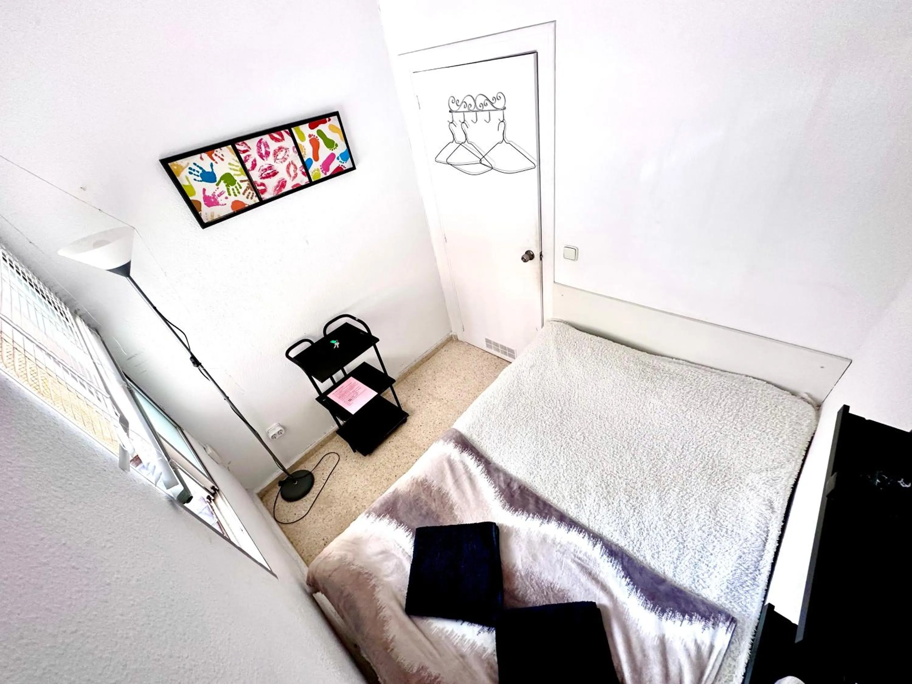 Bed in Las habitaciones en Alicante