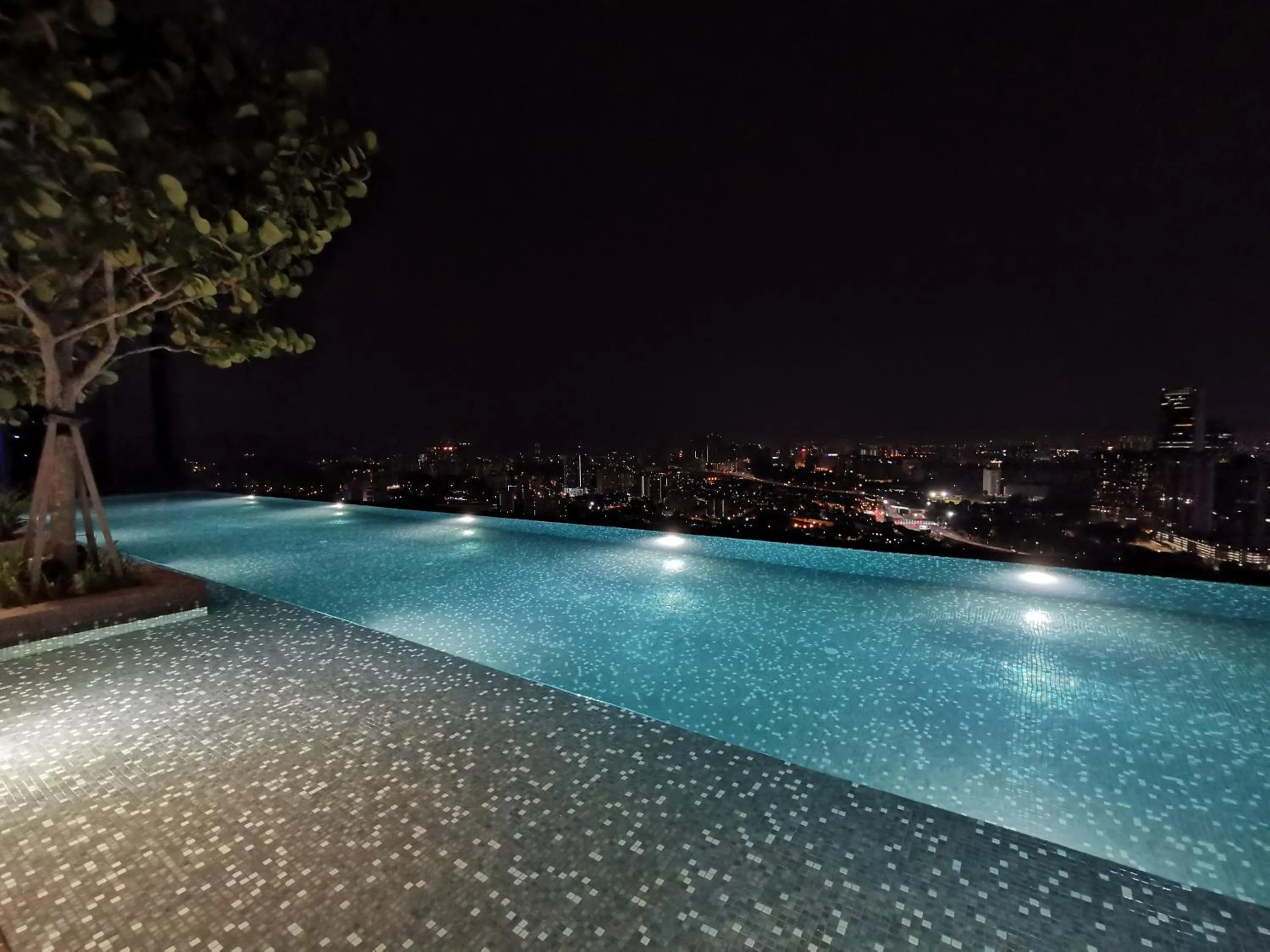 Swimming pool in Expressionz Professional Suites by AURORA SUMMER SUITES