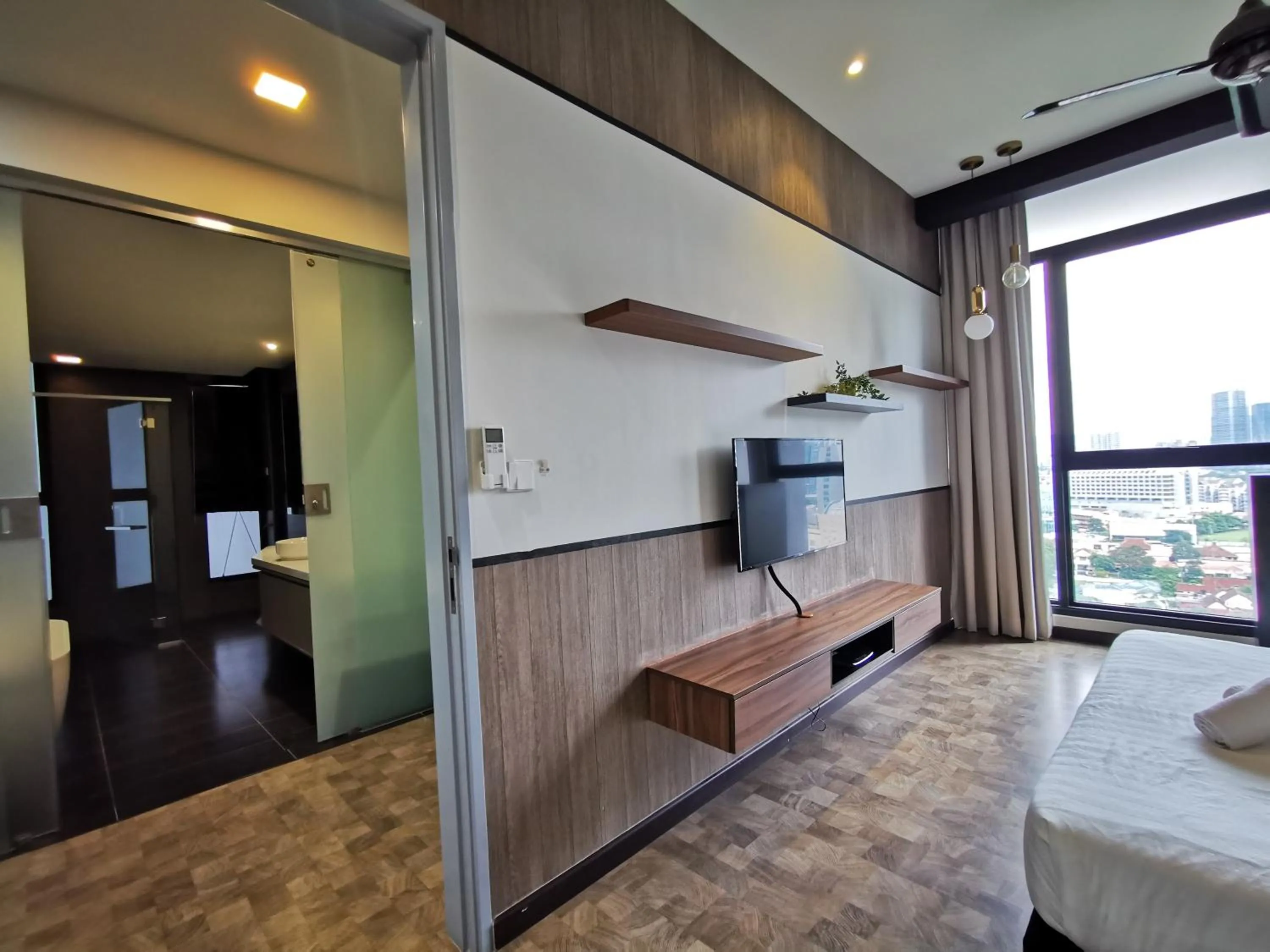 Bed in Expressionz Professional Suites by AURORA SUMMER SUITES