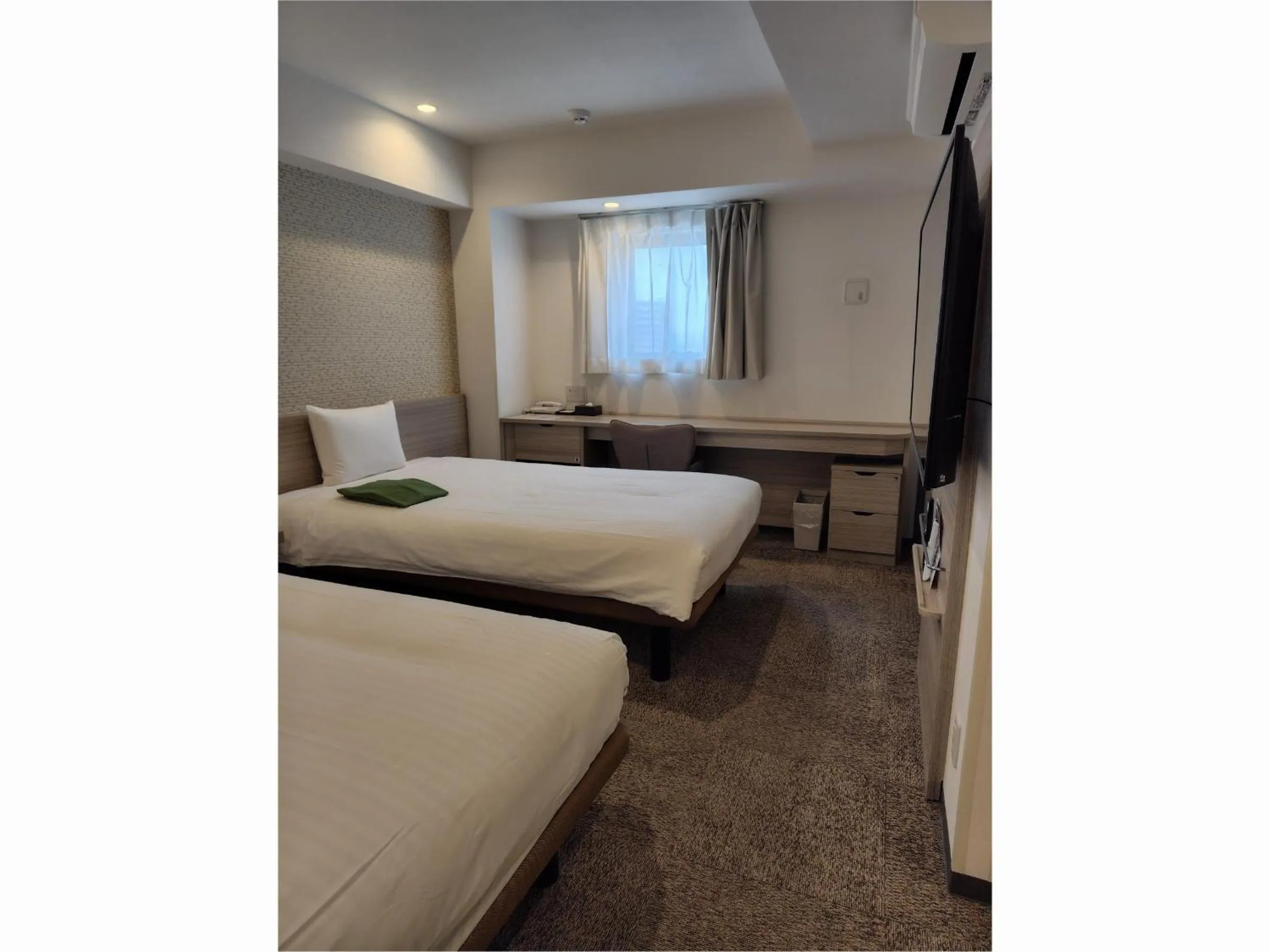 Bed in Kuretake Inn Premium Tajimi Ekimae