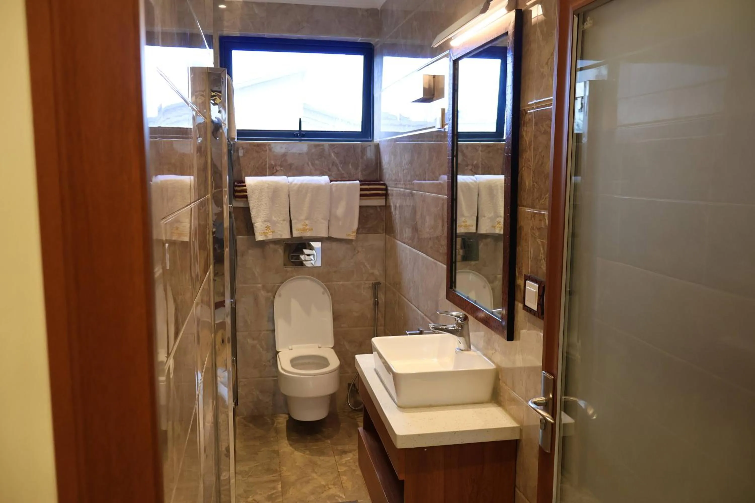 Toilet in Urban Park Suites Hotel