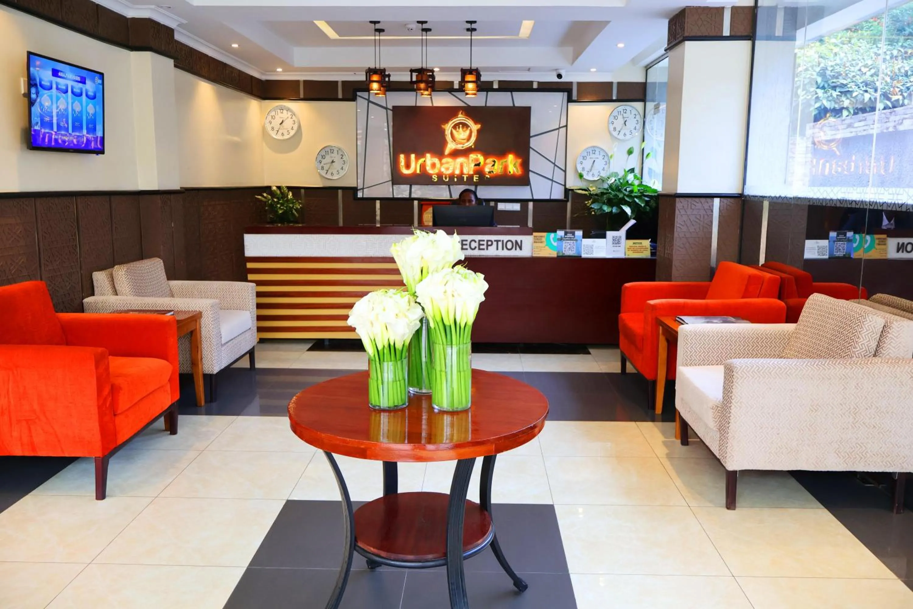 Communal lounge/ TV room in Urban Park Suites Hotel