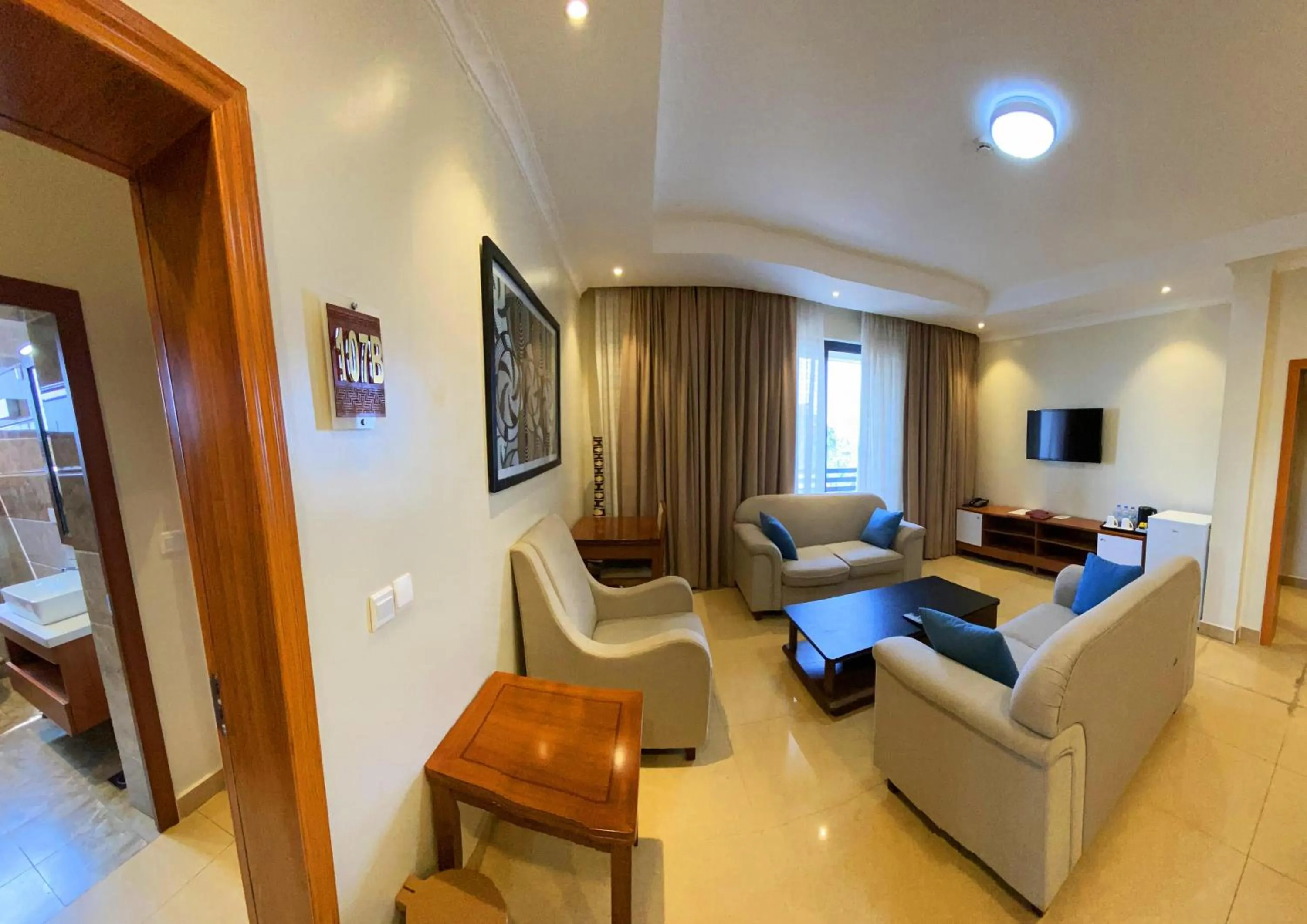 Communal lounge/ TV room in Urban Park Suites Hotel