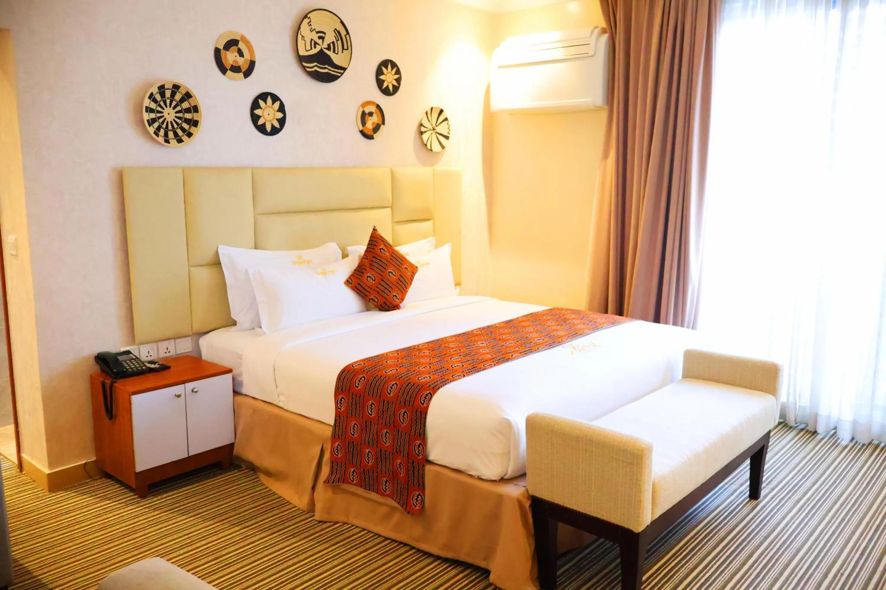 Bed in Urban Park Suites Hotel