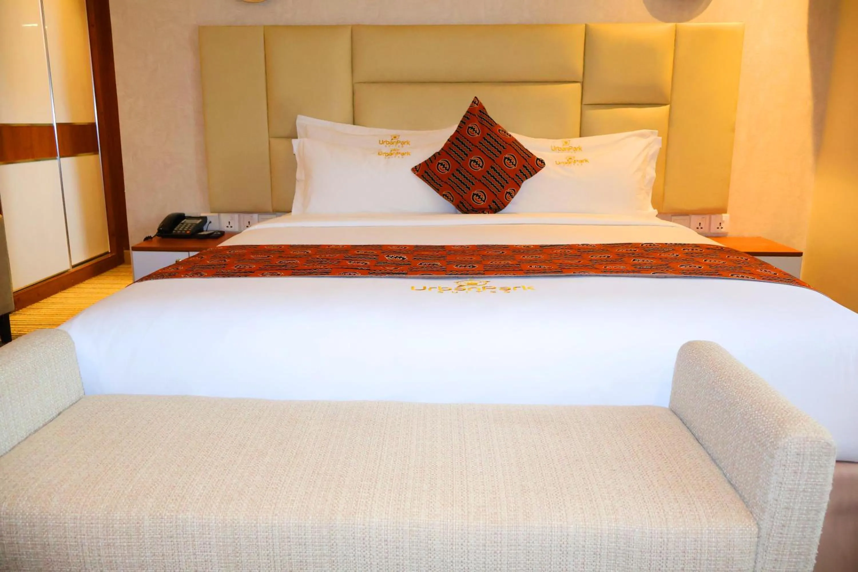 Bed in Urban Park Suites Hotel