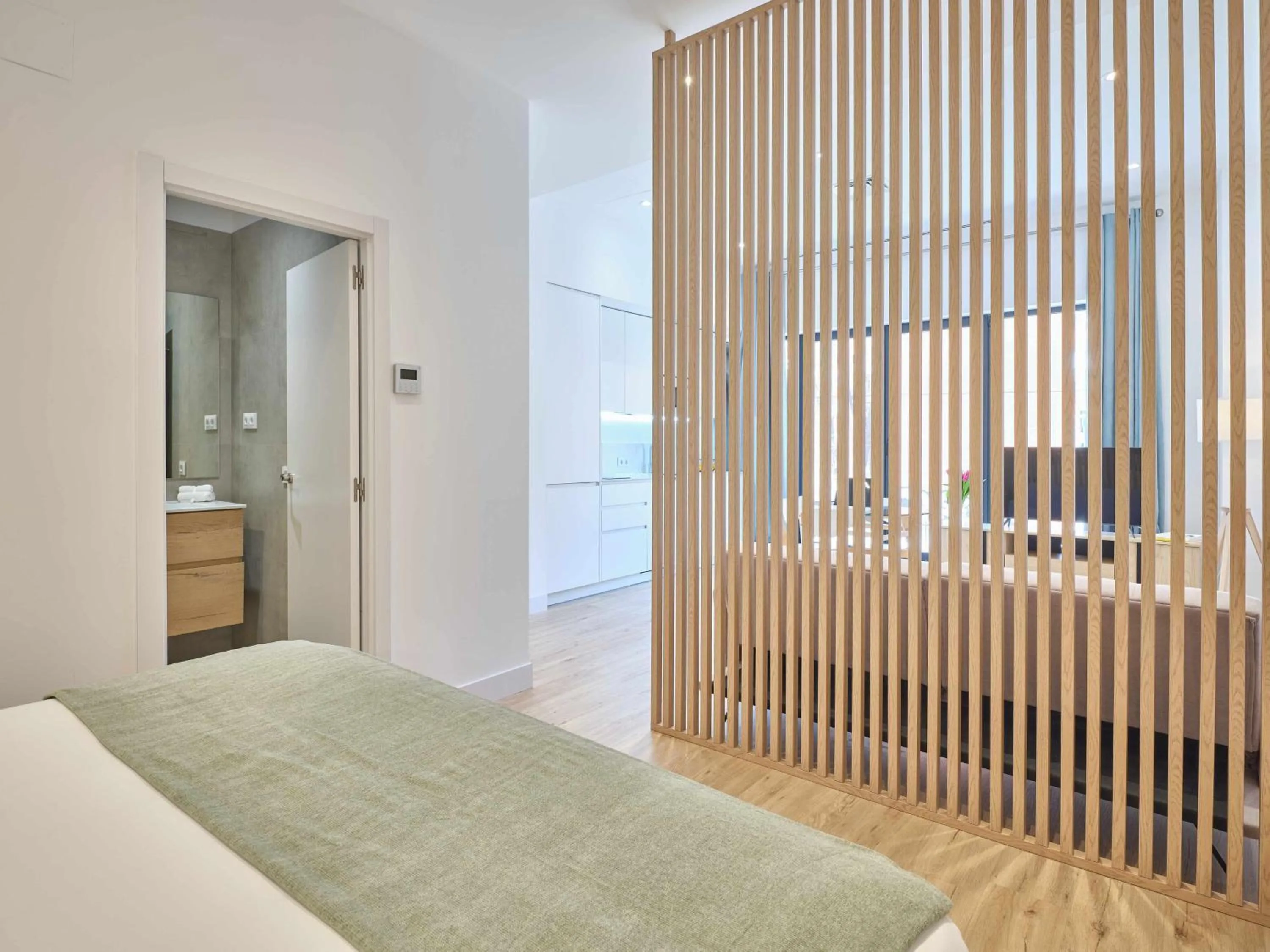 Bed in Paseo Suites Hotel