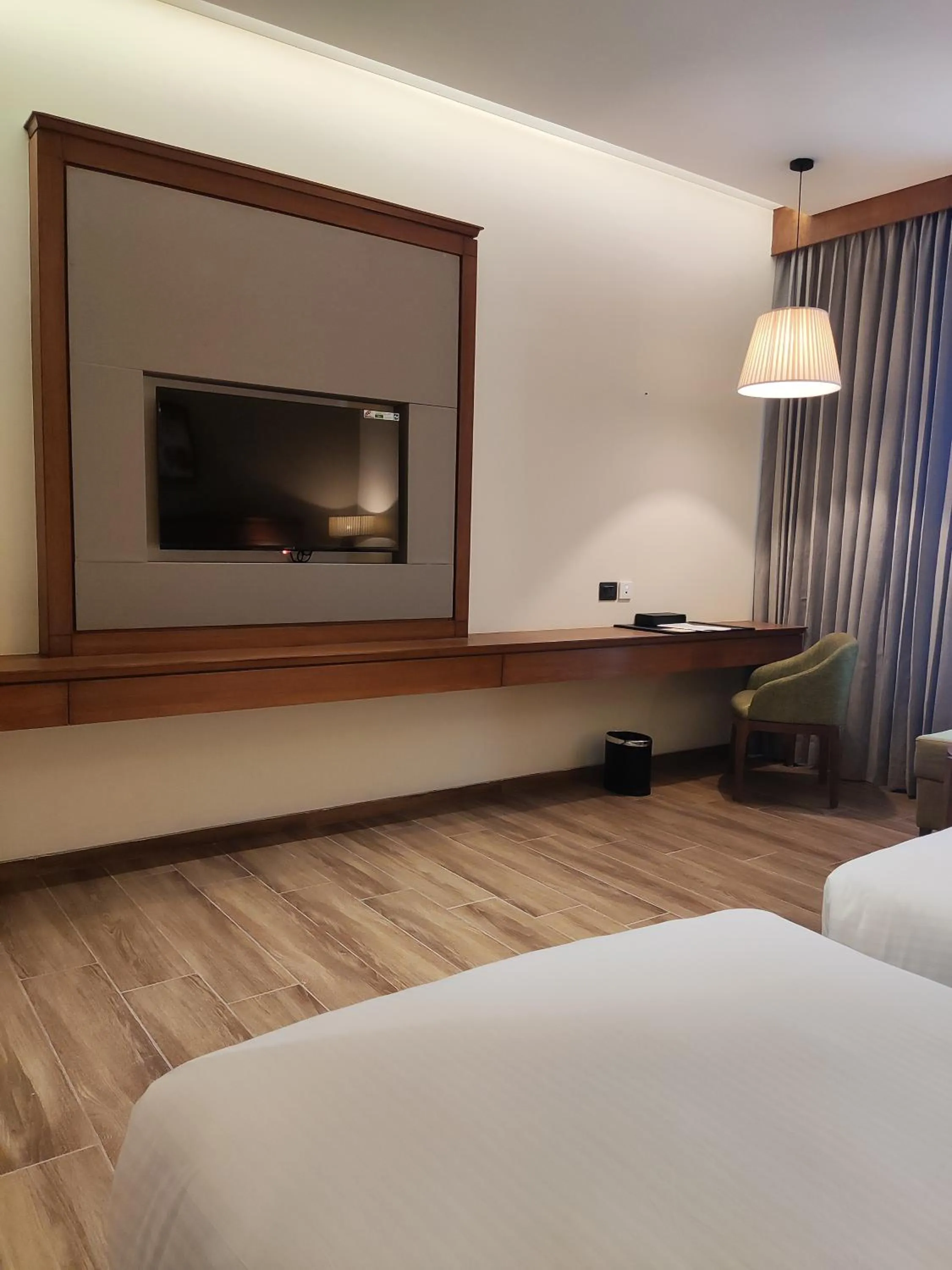 Communal lounge/ TV room, Bed in Sayaji Morbi