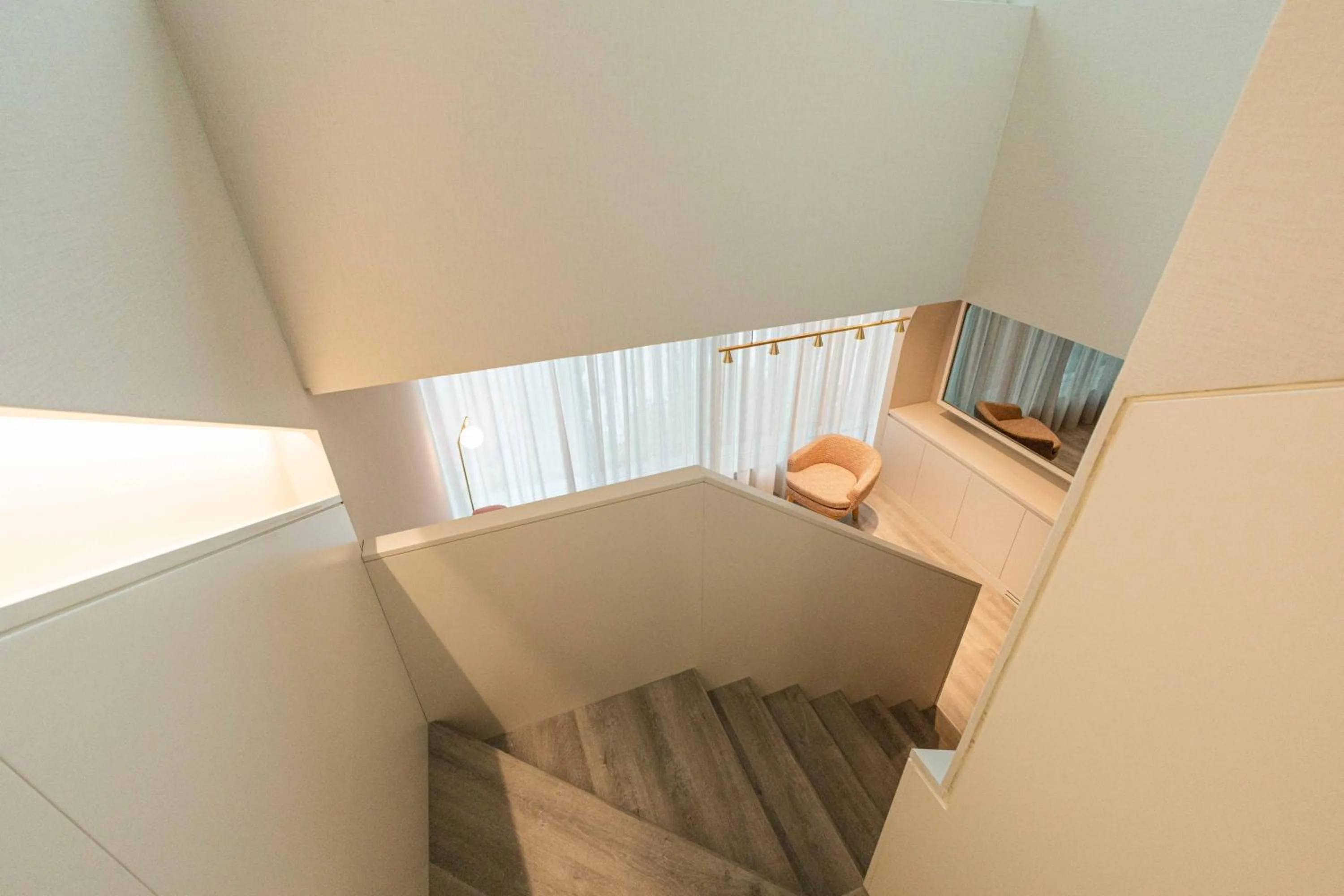 Living room, Bed in LUSTER Hotel