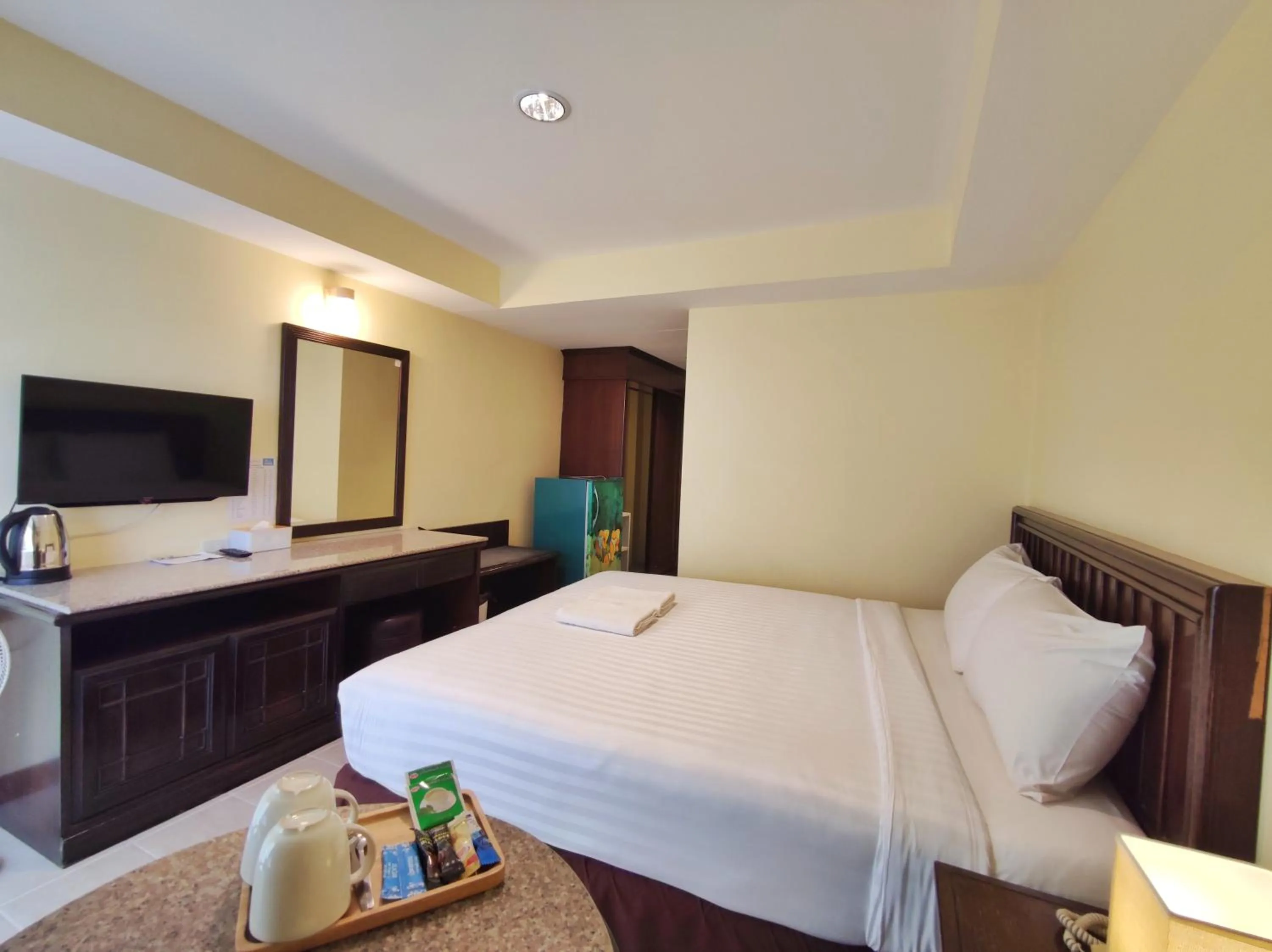 Bed in The Chanthong Residence and Hotel Pattaya