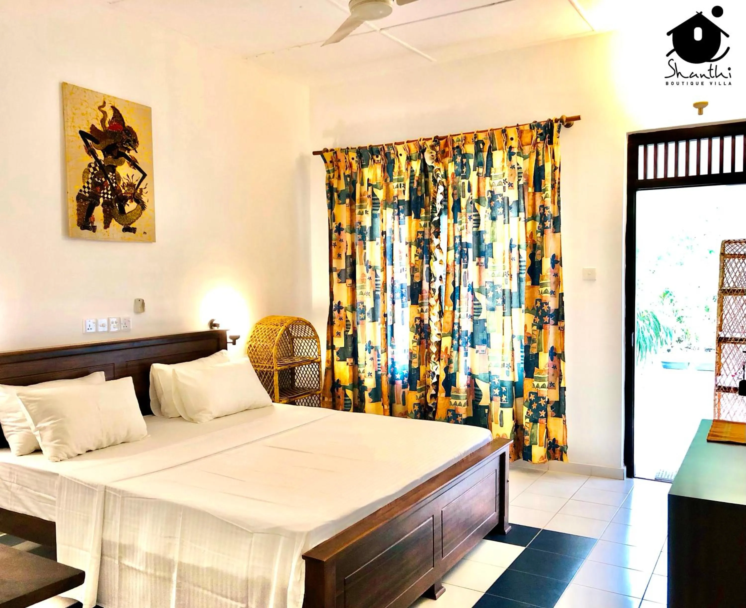 Bed in Shanthi Boutique Villa