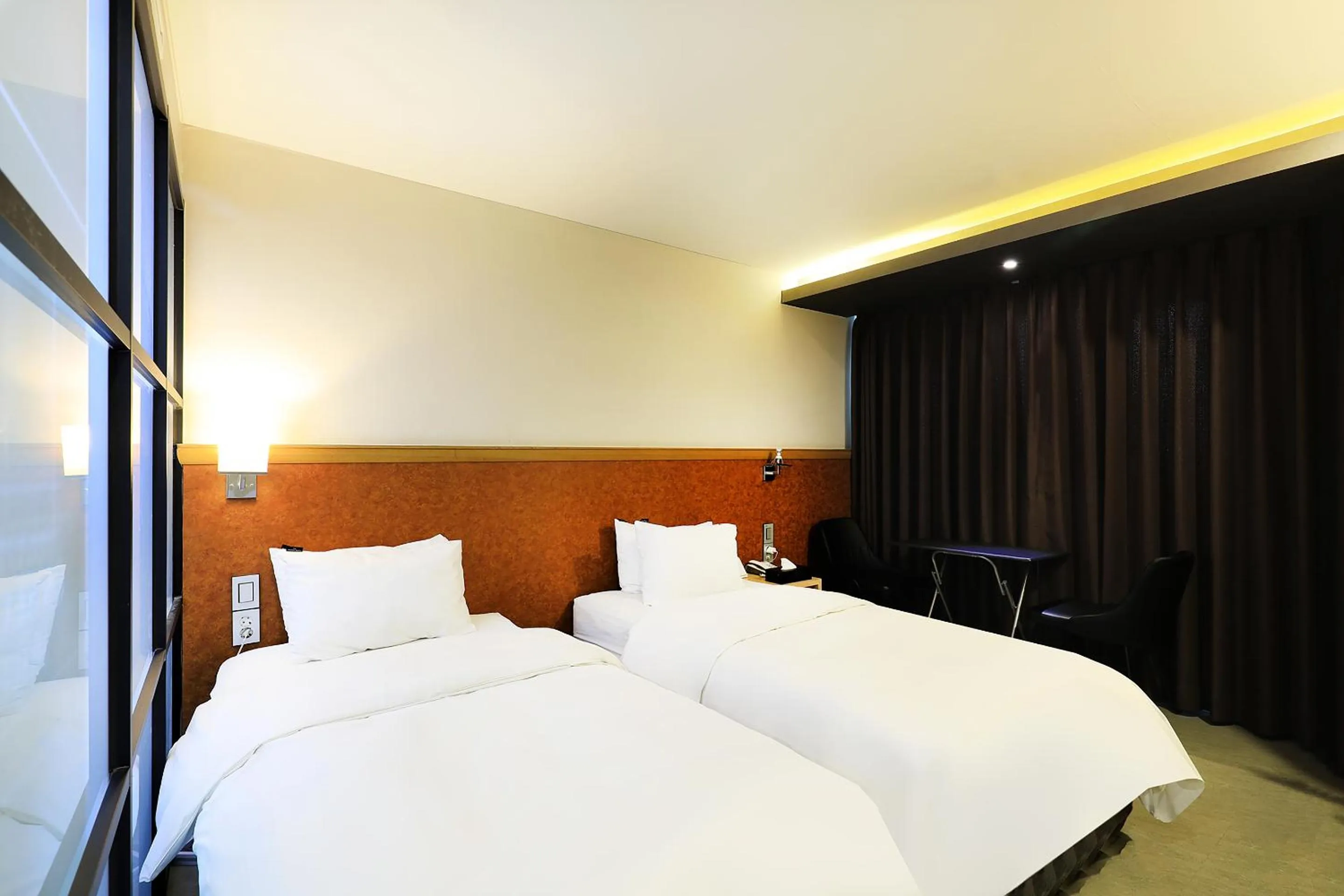 Bed in CS Avenue Tourist Hotel