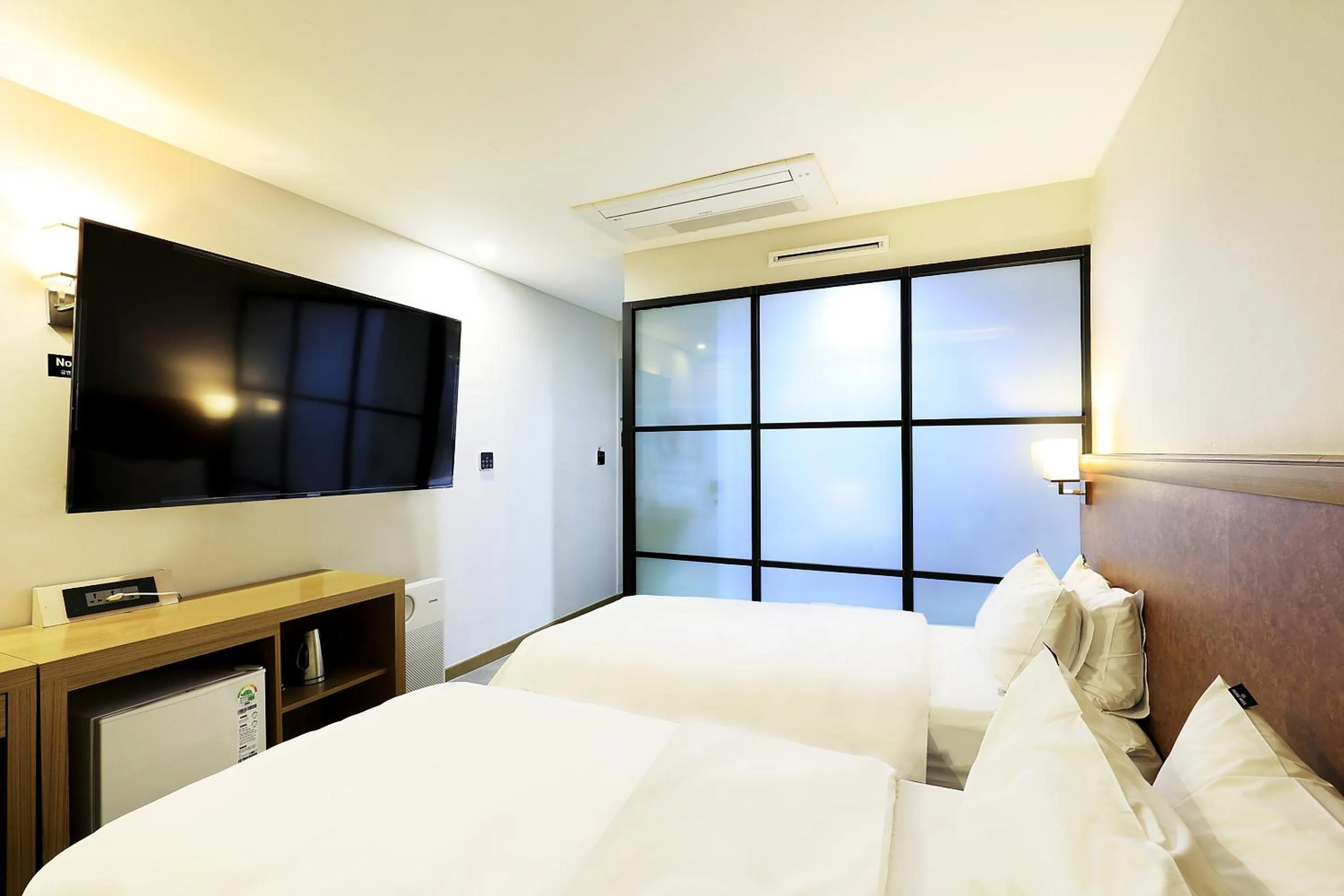 Bed in CS Avenue Tourist Hotel