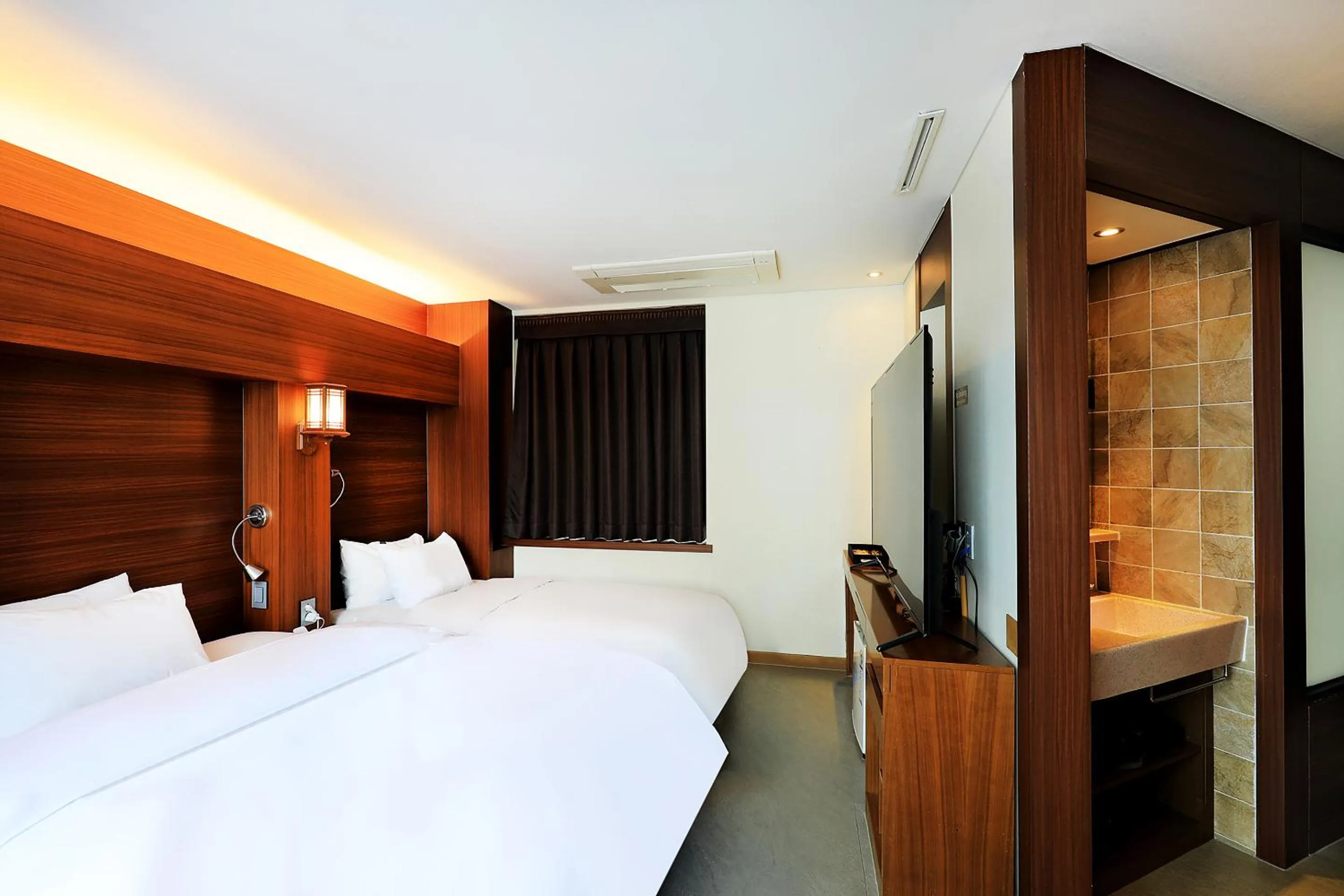 Bed in CS Avenue Tourist Hotel