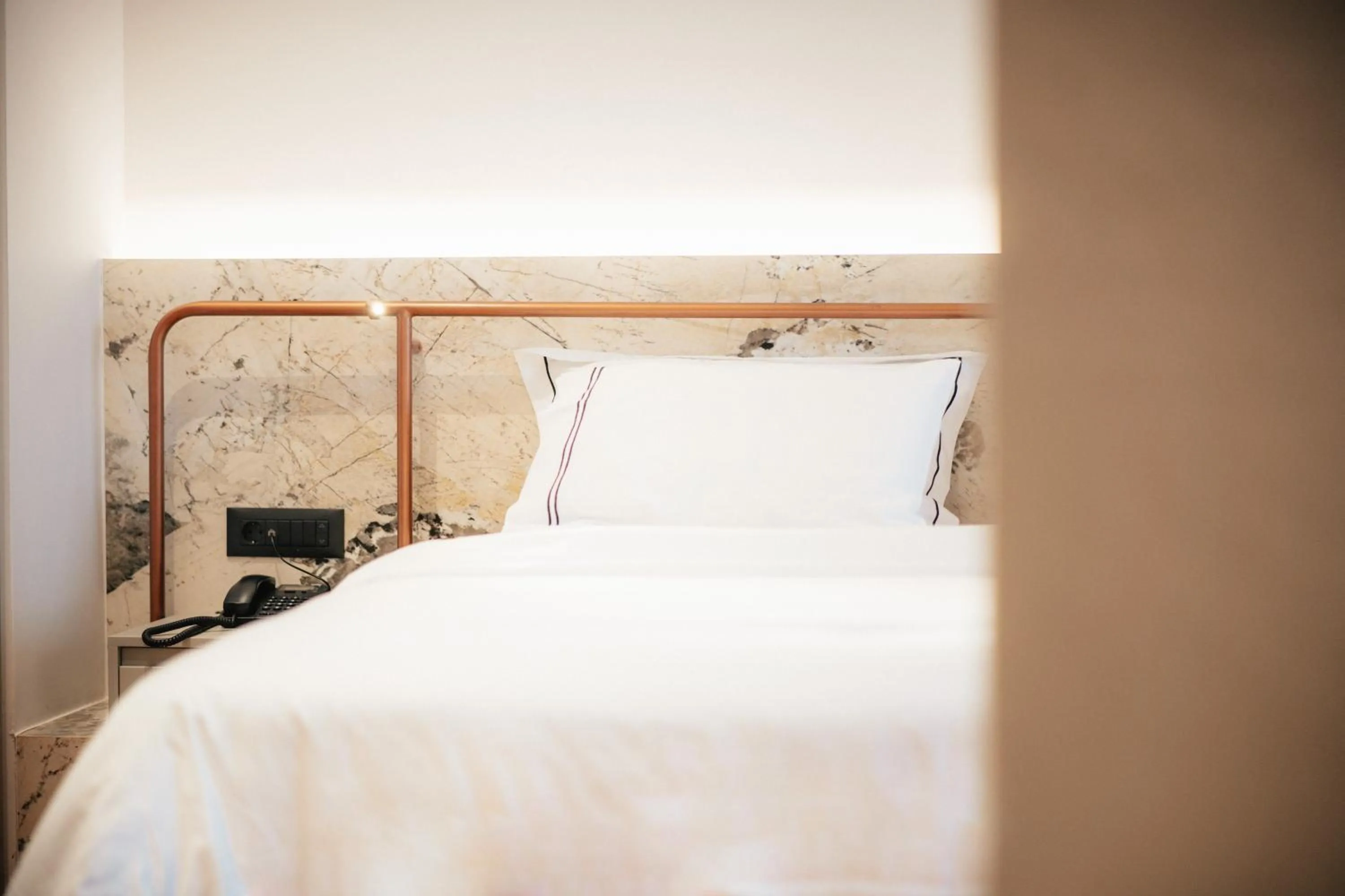 Bed in Amario Suites Hotel