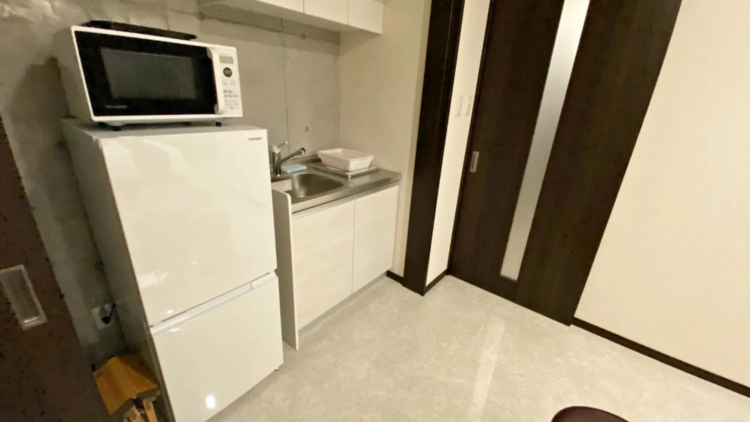 Kitchen or kitchenette in Tabinoteitaku Okinawa Naha 2nd