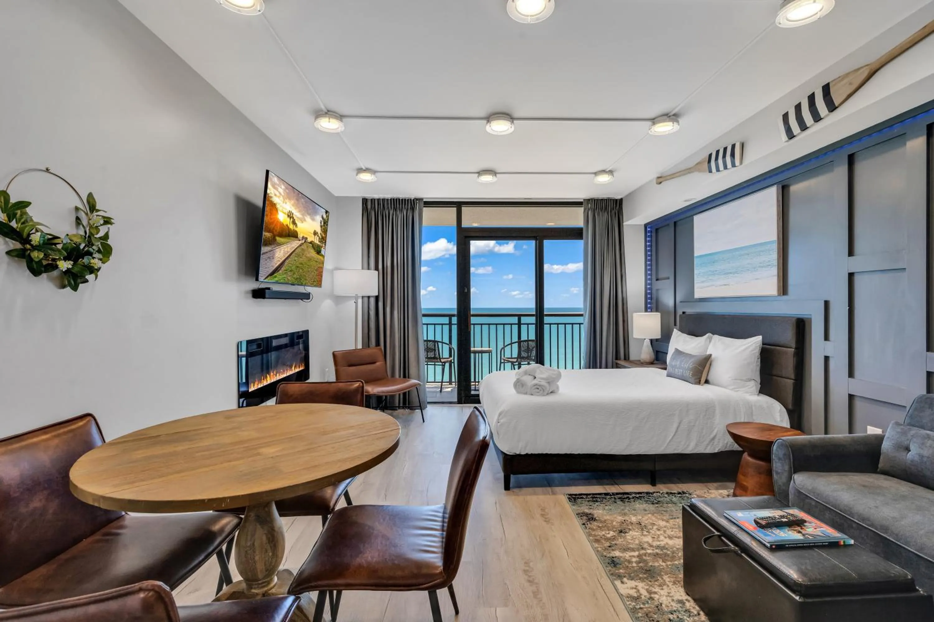 Living room, Bed in Breakers Tower 1BR Oceanfront Condo