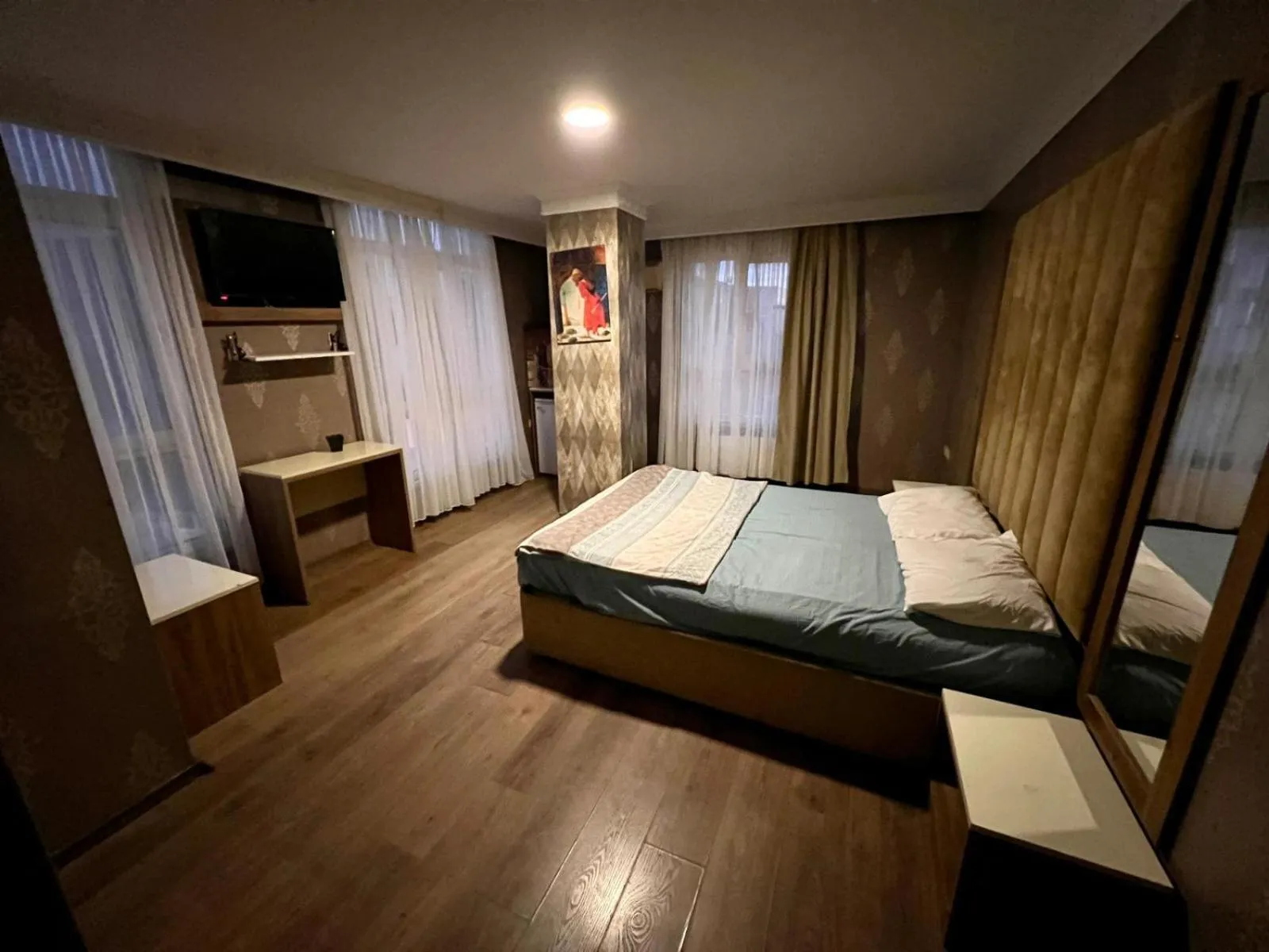 Bed in CAMELLİA SUİT HOTEL