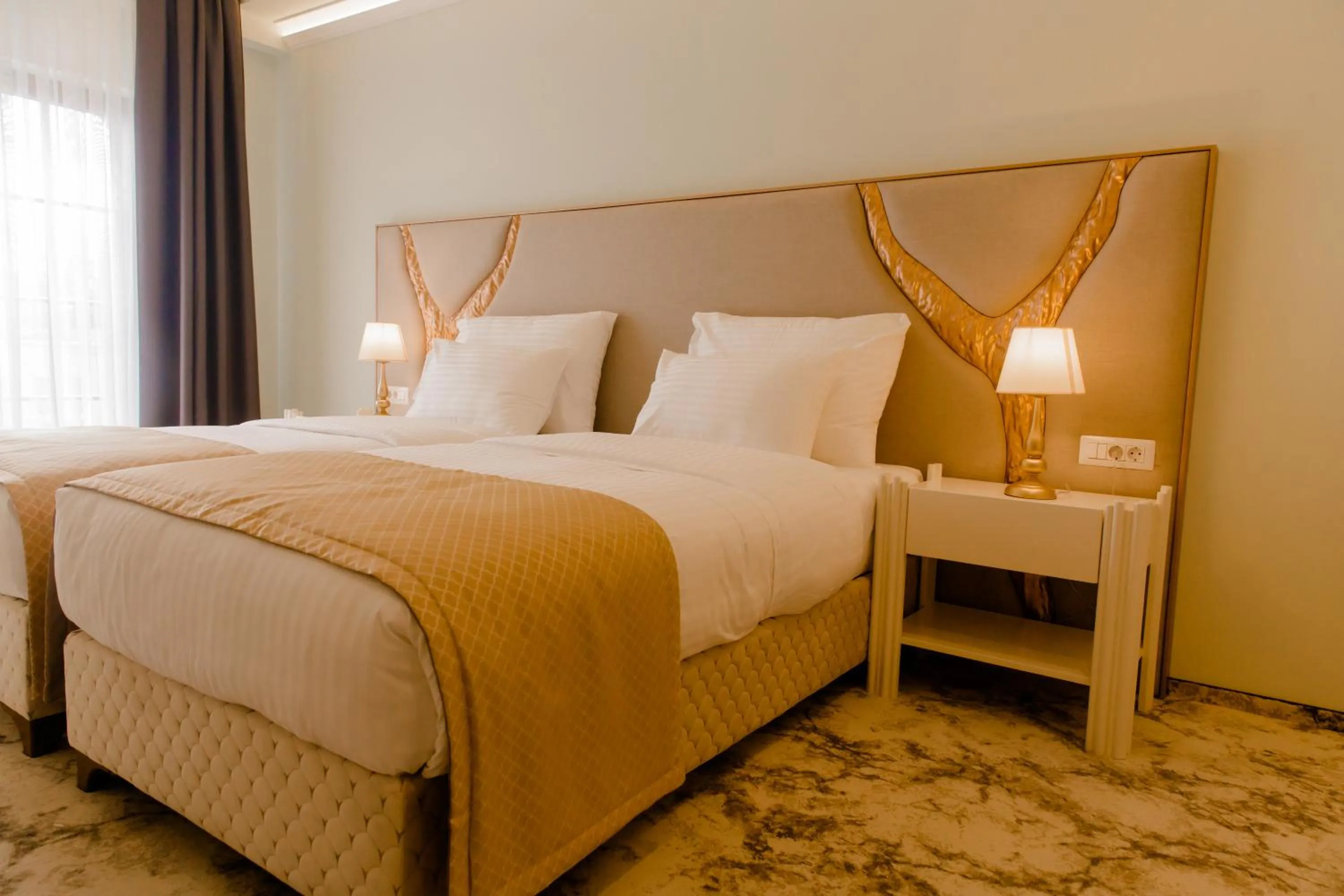 Bed in Muller Hotel Boutique & Spa