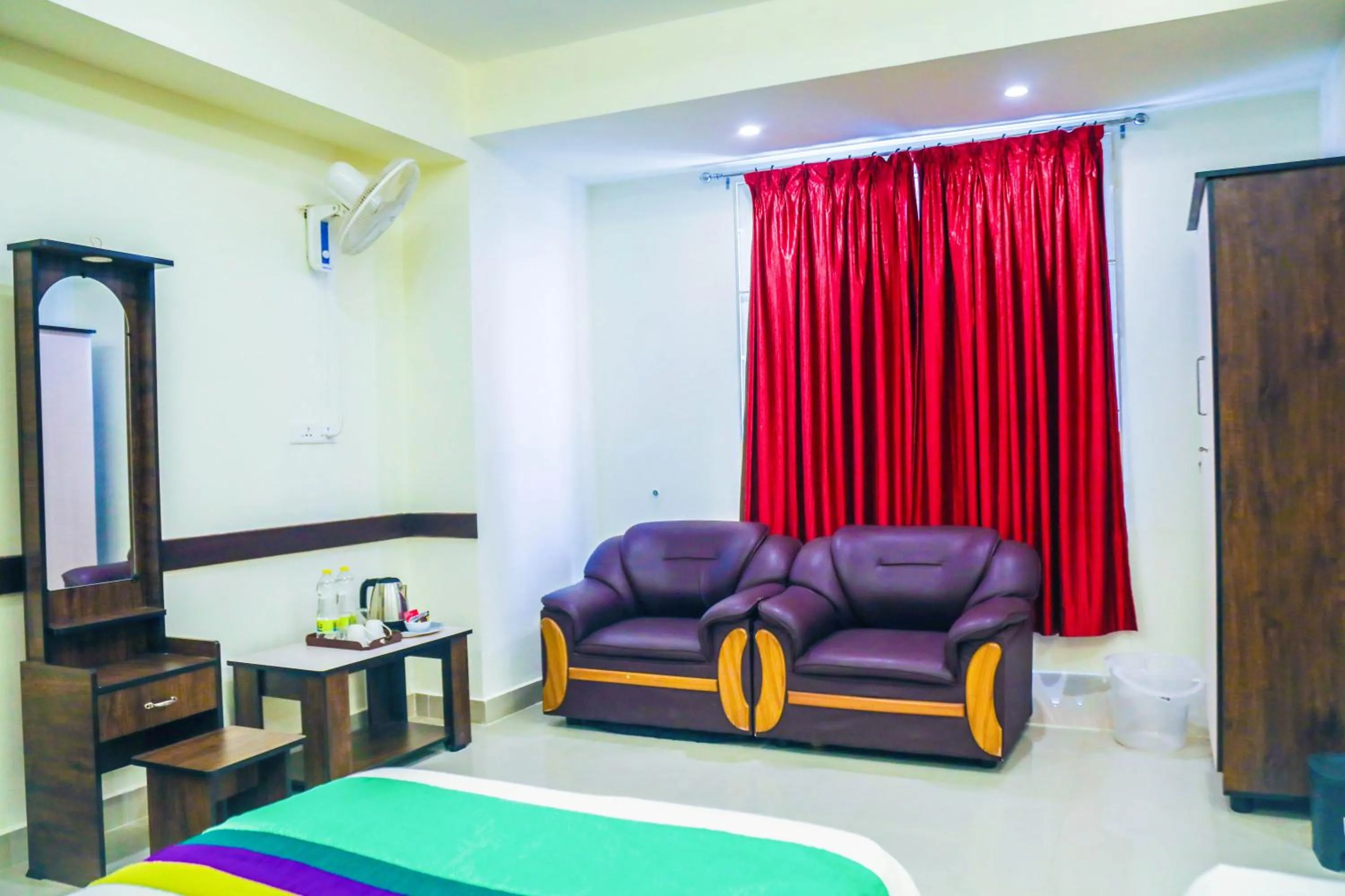 Seating area, Bed in Treebo Naaz Royal