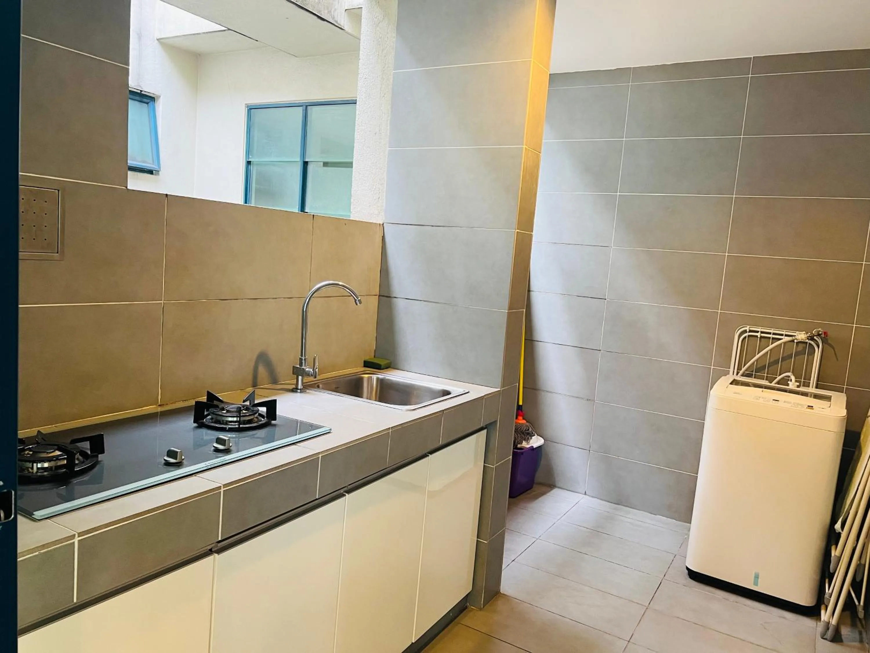 Kitchen or kitchenette in CozyHome Suites @ Casa Residency