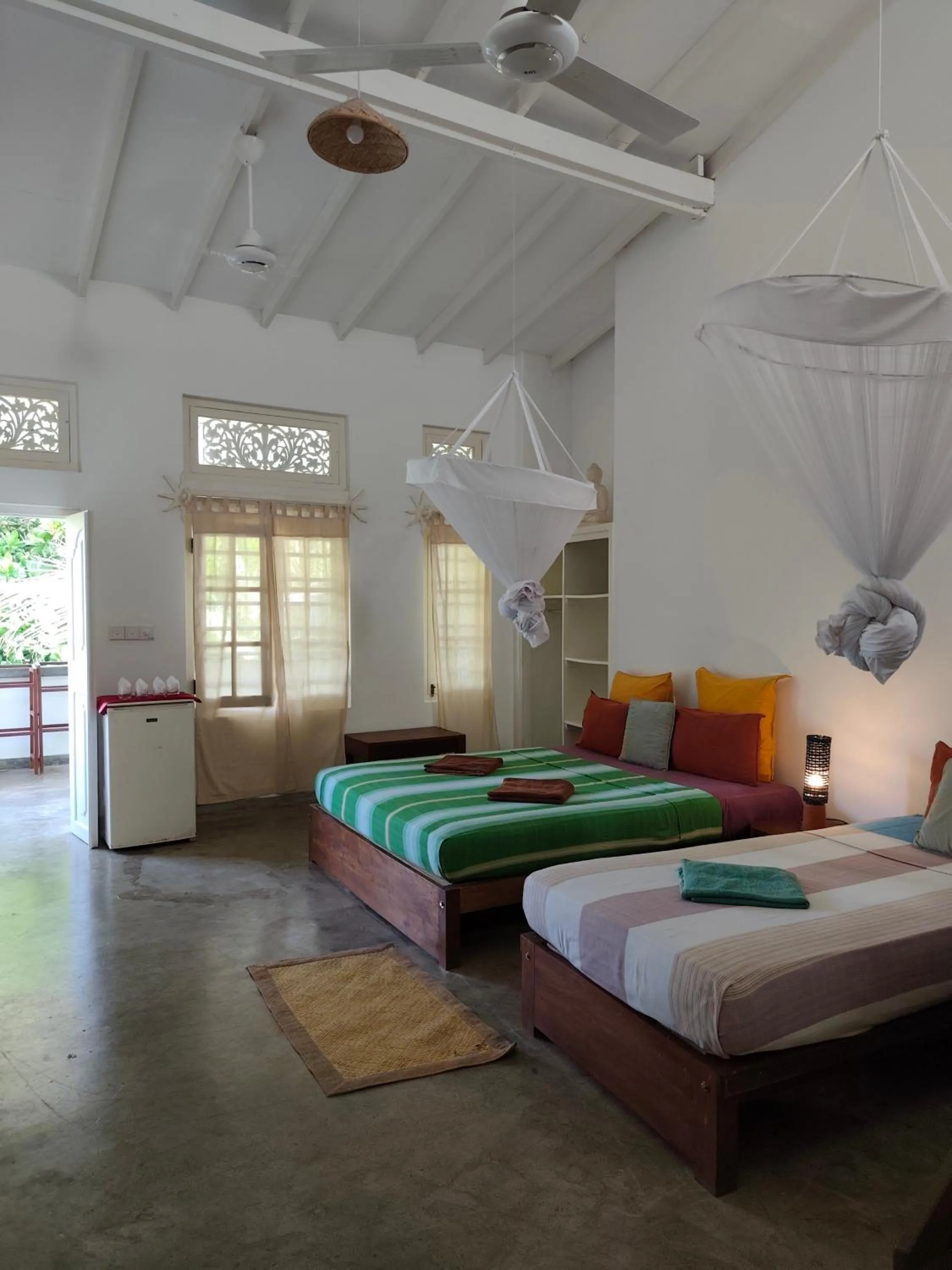 Bed in Palm villa Mirissa hotel&spa