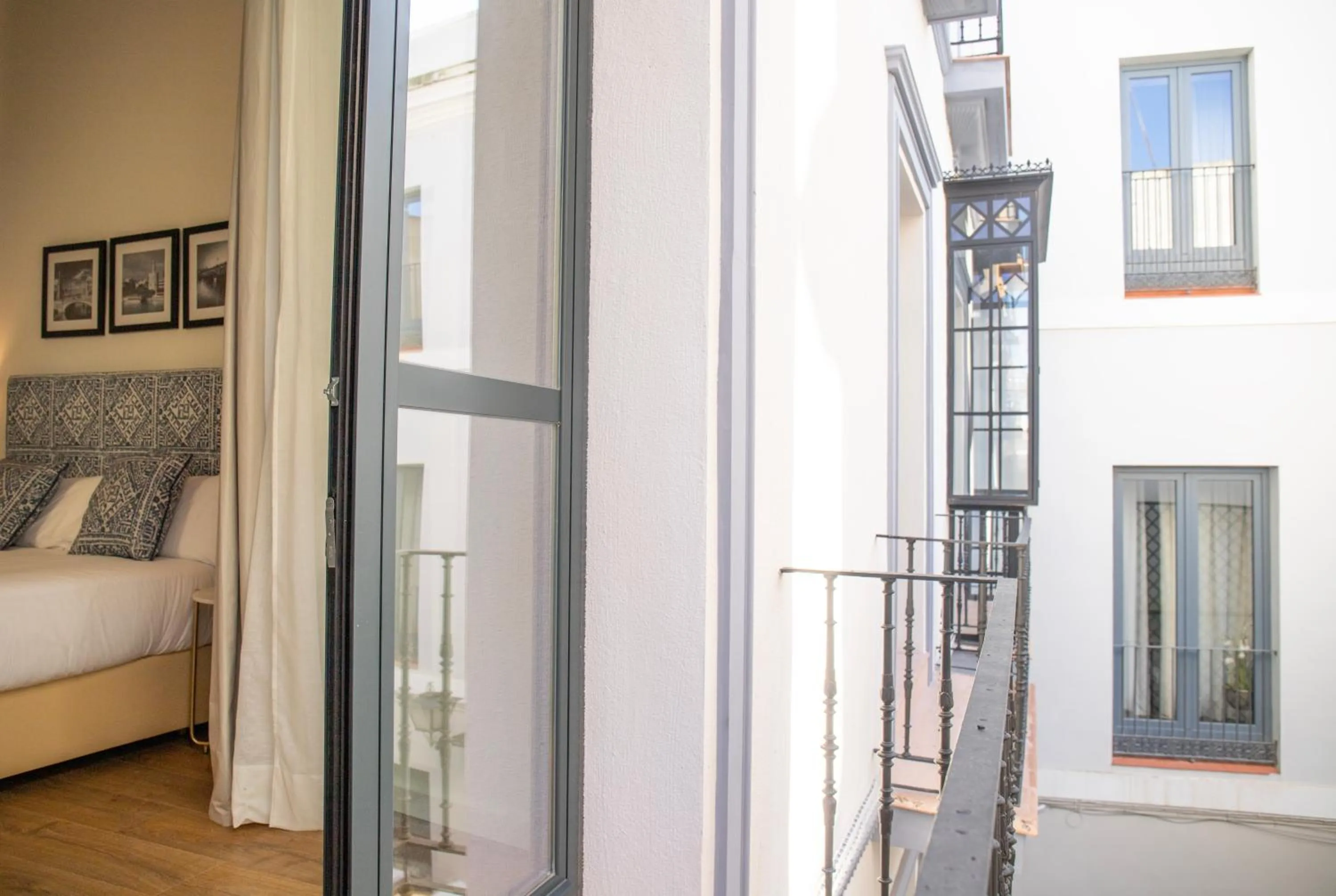 View (from property/room), Bed in nQn Aparts & Suites Sevilla