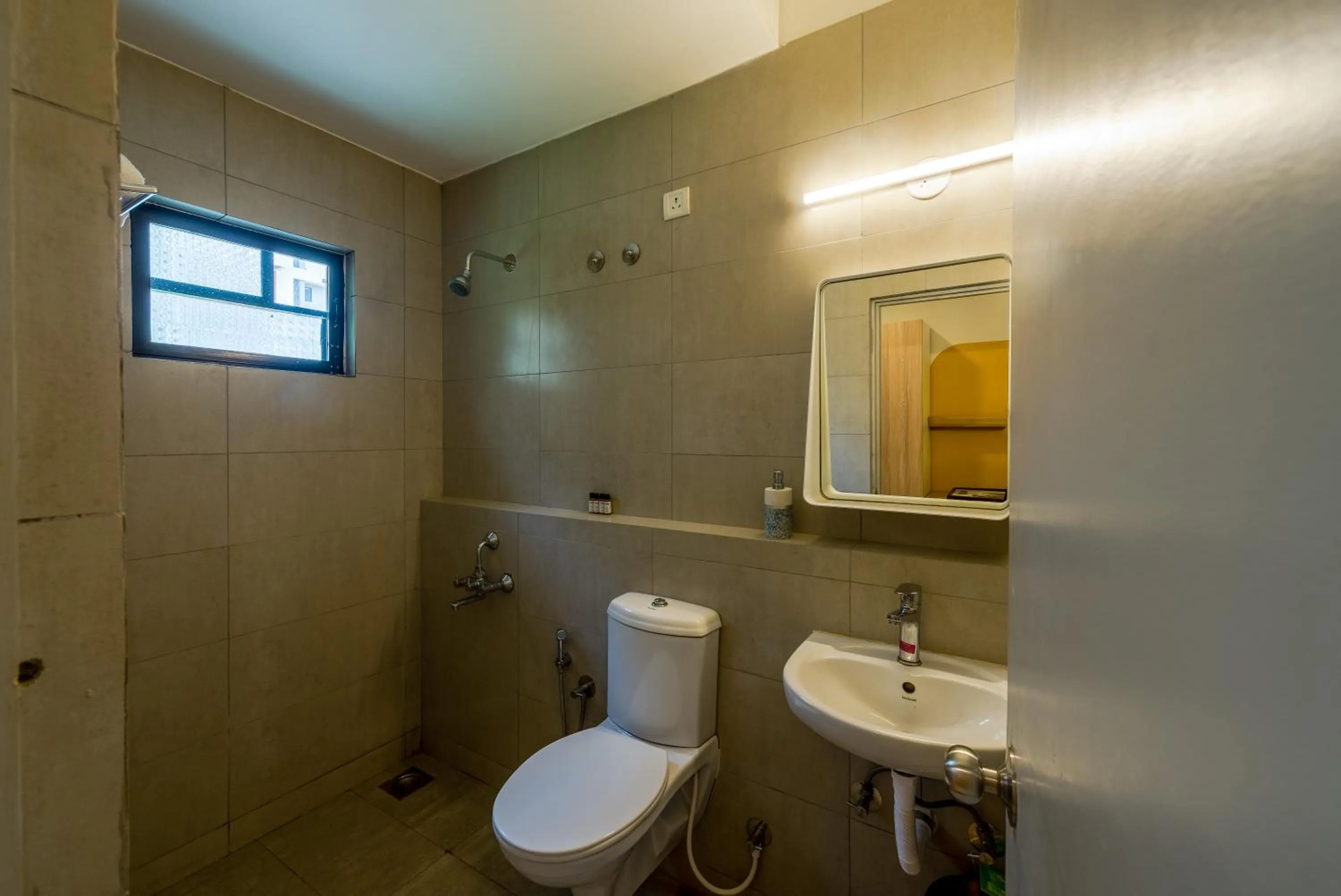 Toilet in Olive Hotel Calangute Niwasa by Embassy Group