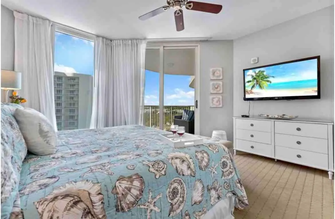 Bed in Pink Sunsets at the Palms of Destin Across from Beach, Heated Pool Shuttle & Dining
