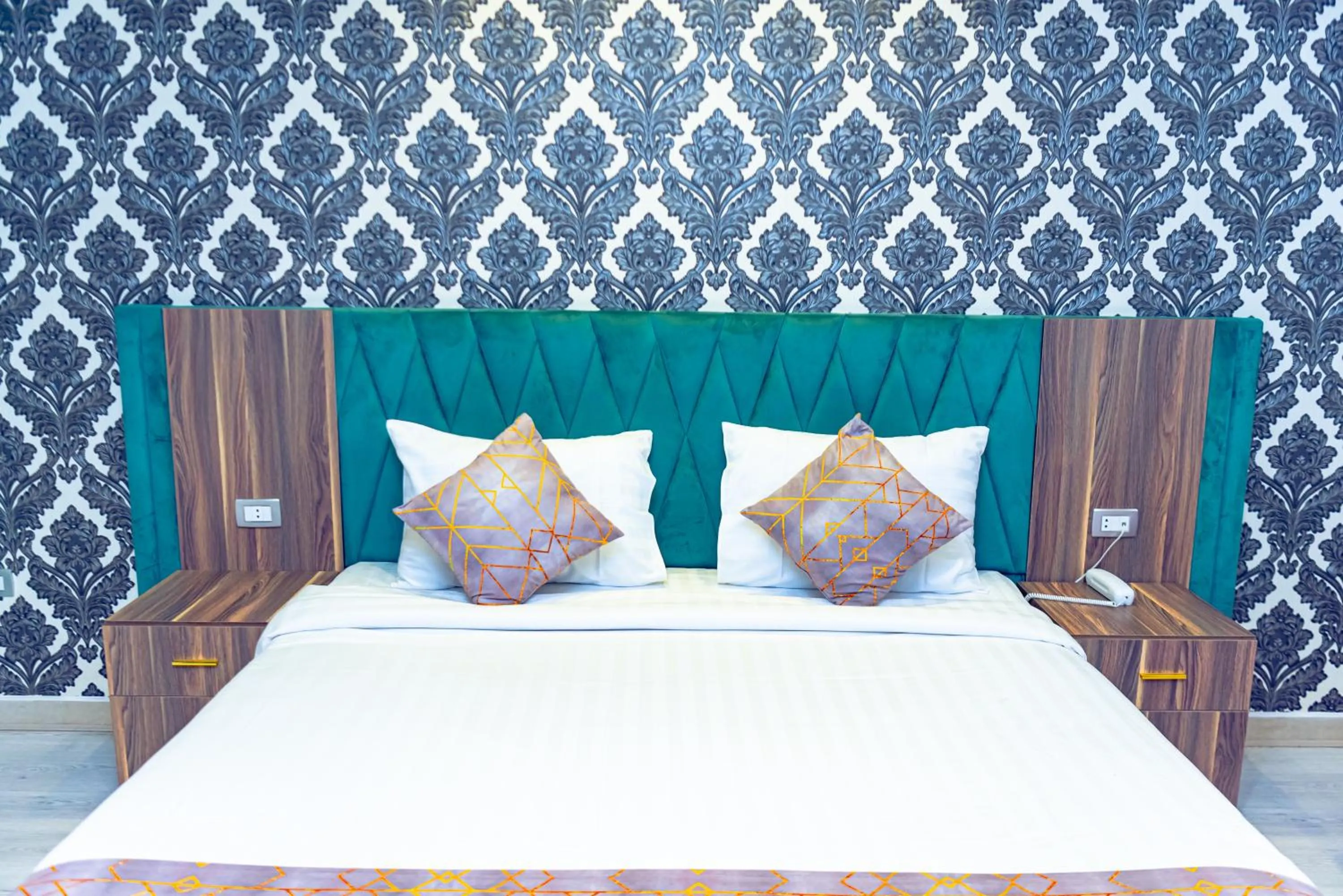 Bed in Jasmine Pyramids Hotel