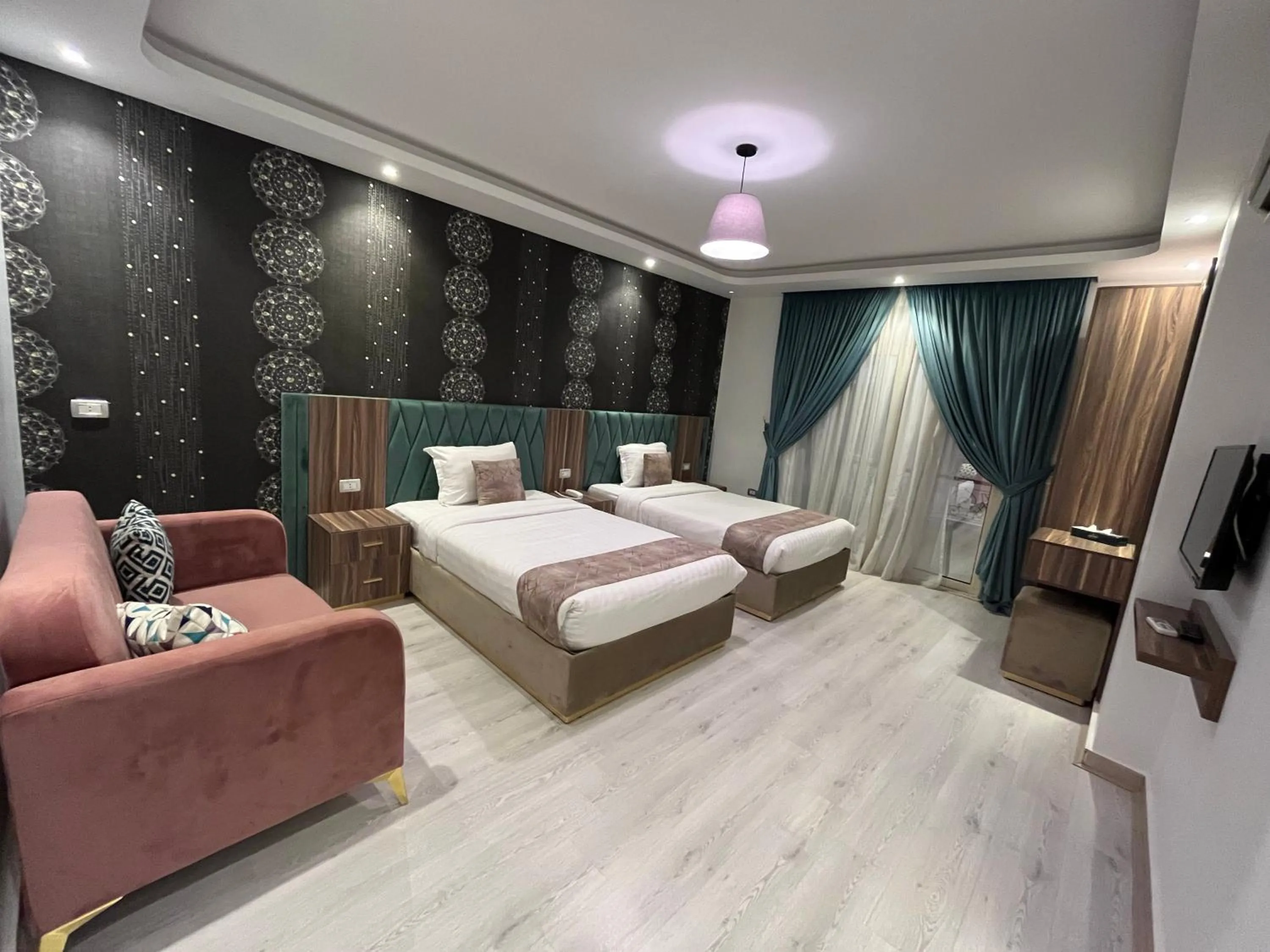 Bed in Jasmine Pyramids Hotel