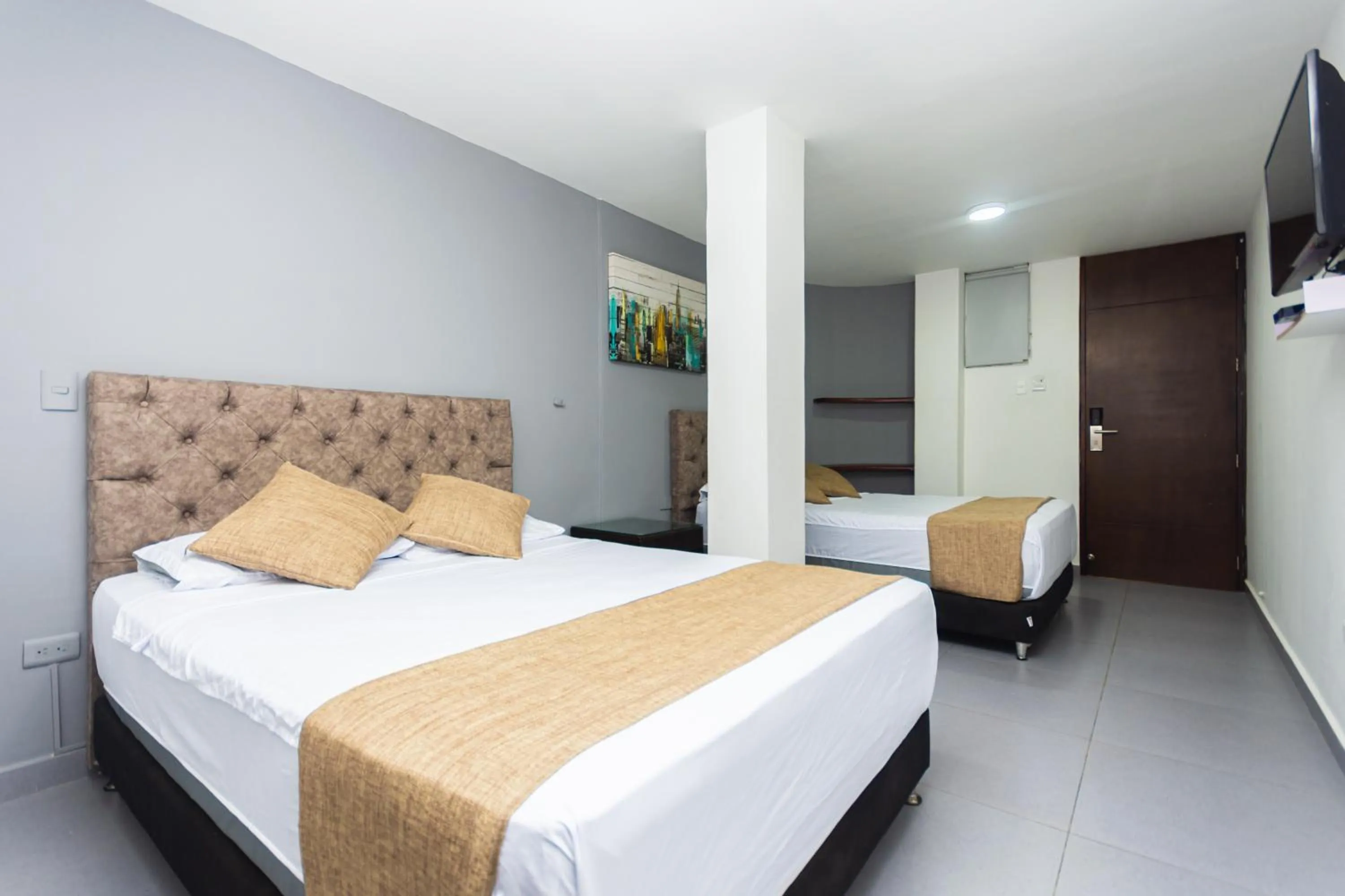 Communal lounge/ TV room, Bed in Hotel Med Suites 94