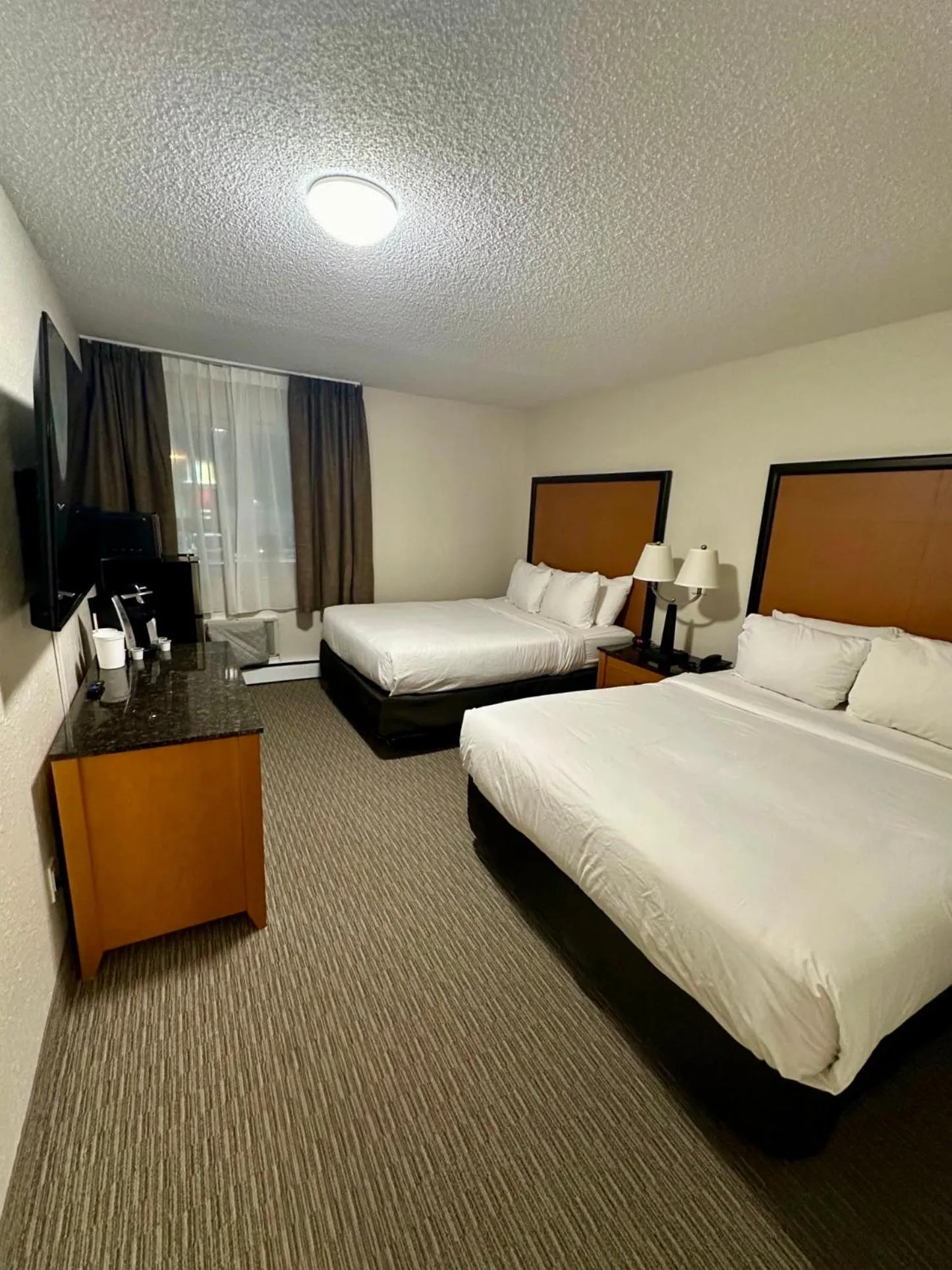 Bed in Anavada Inn & Suites - Grande Prairie