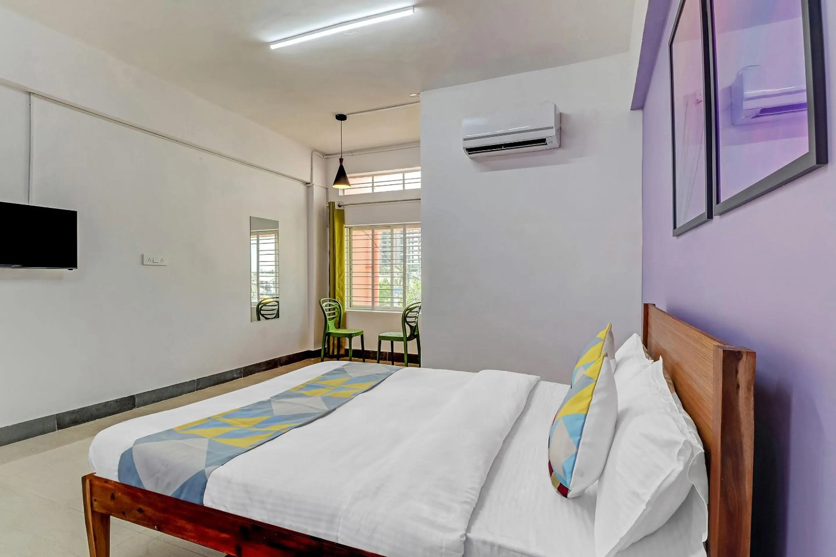 Bedroom, Bed in Capital O Elite Stay Jp Nagar Near SRI SATHYA GANAPATHI SHIRDI SAIBABA Temple