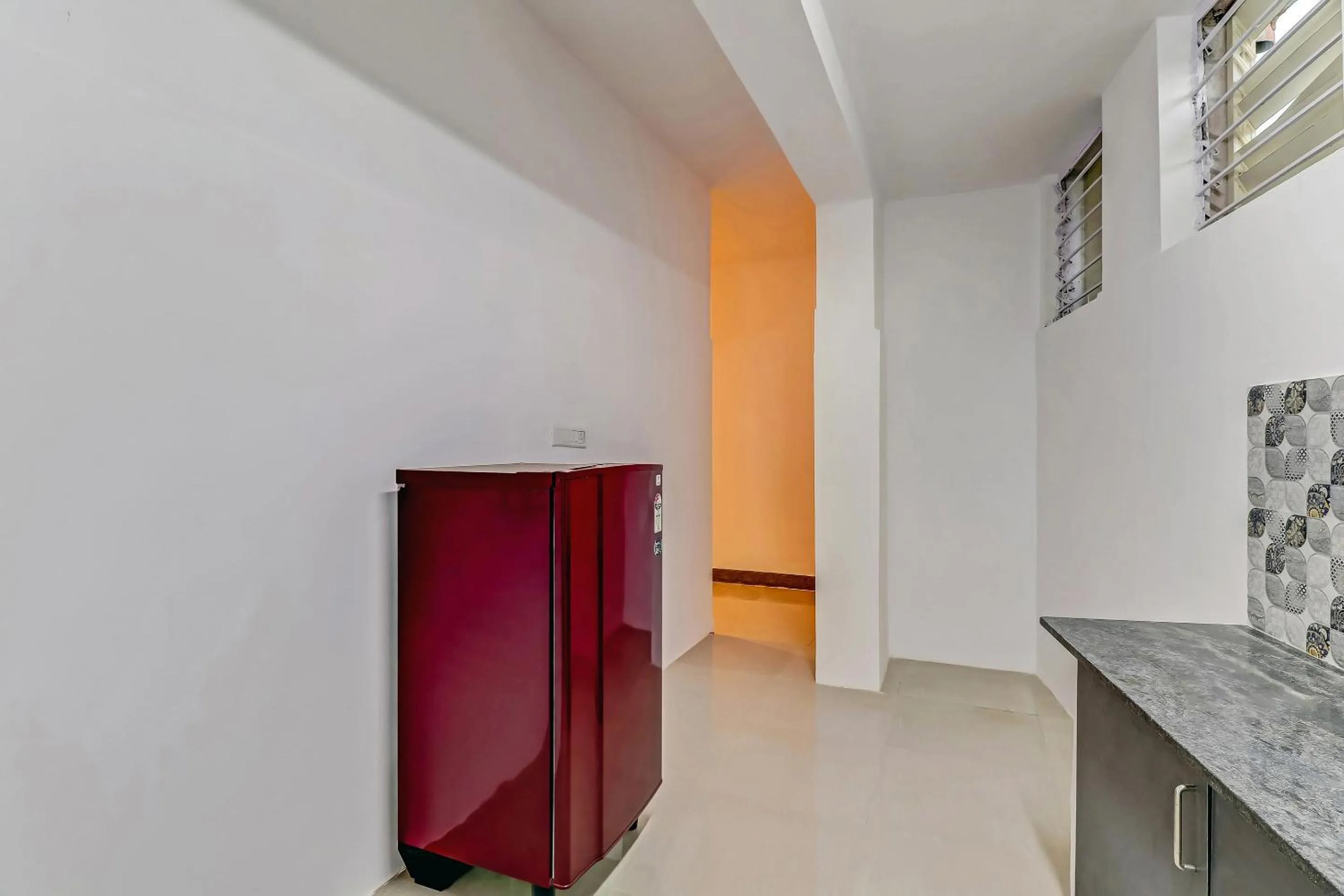 Kitchen or kitchenette in Capital O Elite Stay Jp Nagar Near SRI SATHYA GANAPATHI SHIRDI SAIBABA Temple