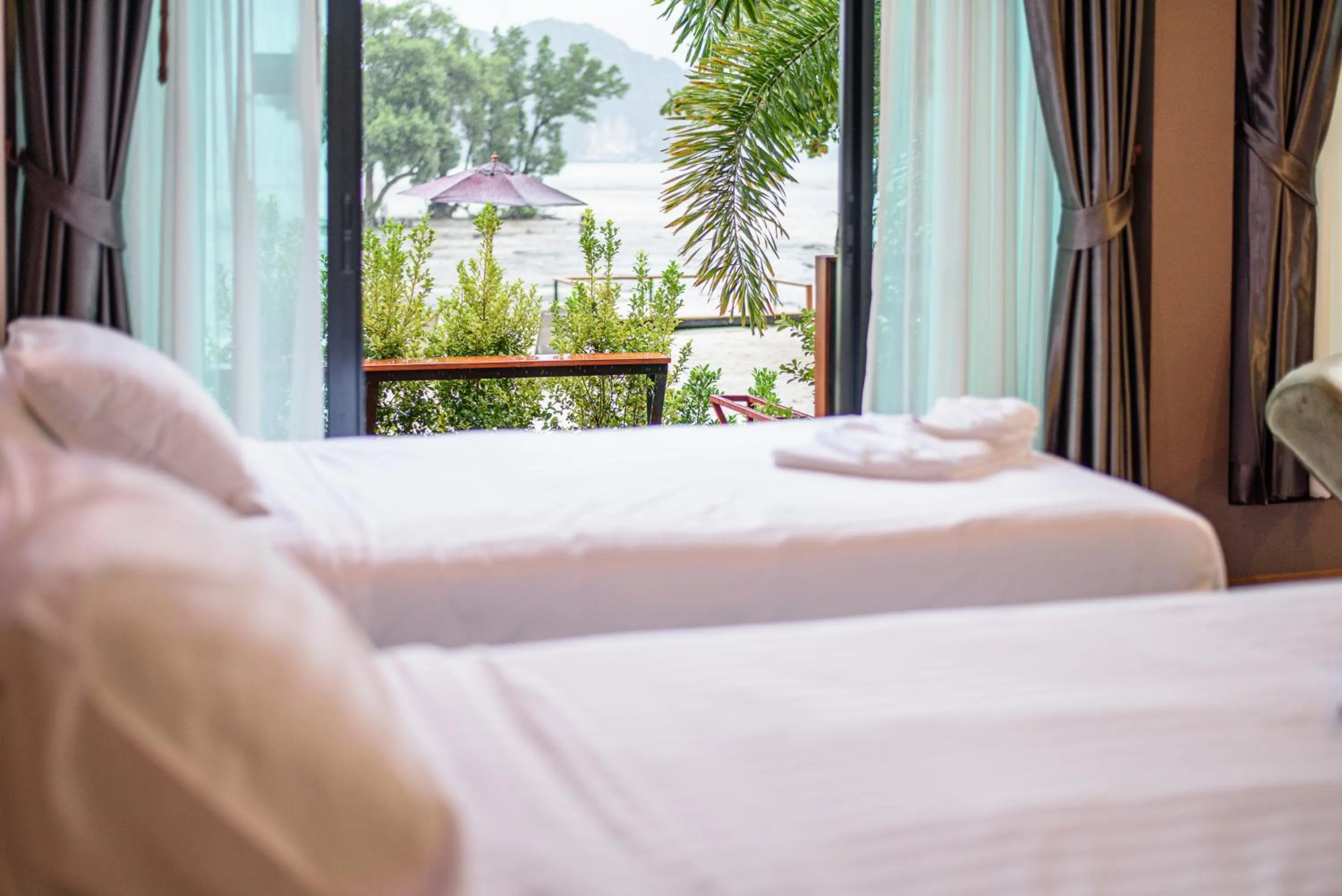 Bed in Mangrovebay Krabi Beachfront Pool Villa