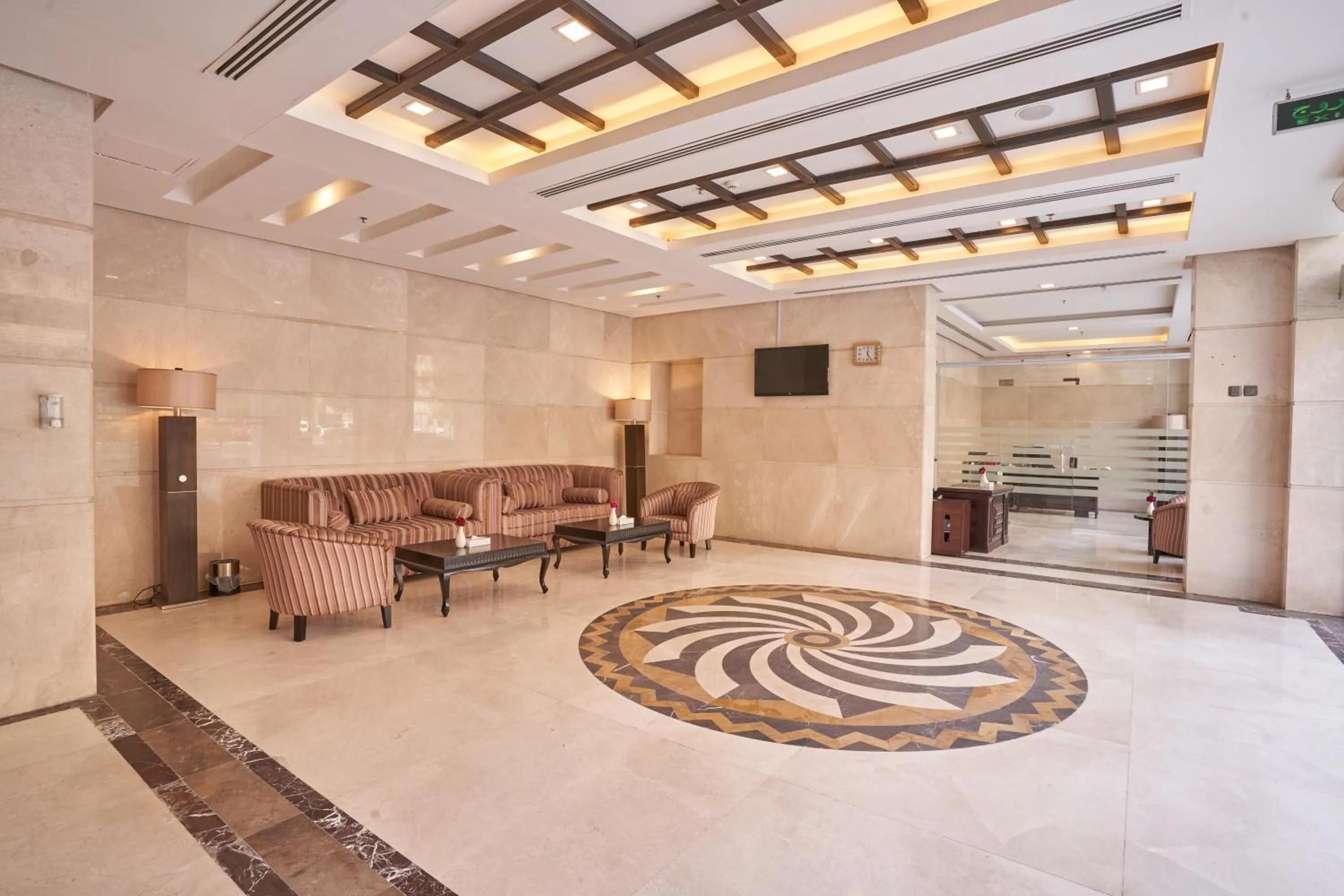 Communal lounge/ TV room in Al Hidayah Towers Hotel