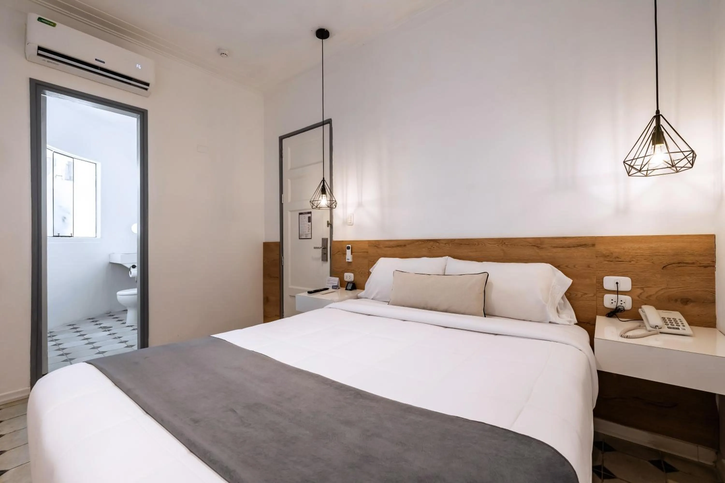 Bed in TARATA BOUTIQUE HOTEL