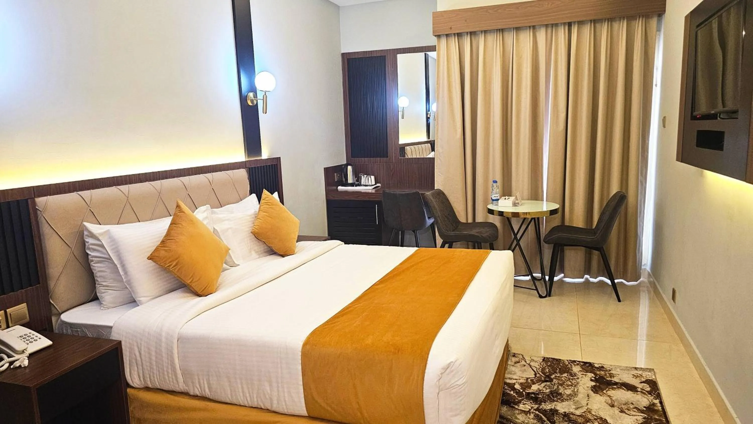 Bed in Concorde Inn Hotel