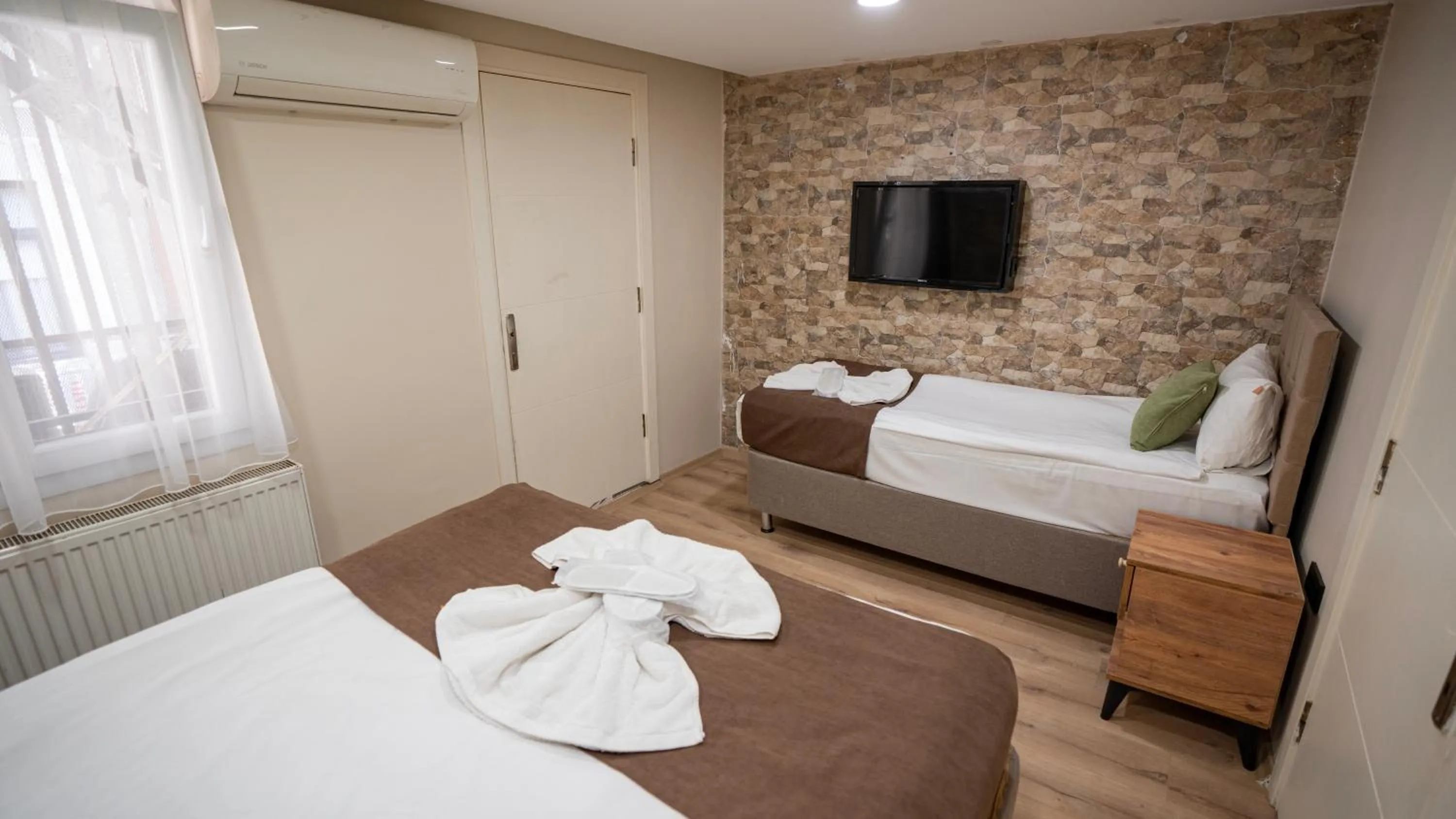 Bed in MİLA SUİTES TAKSİM