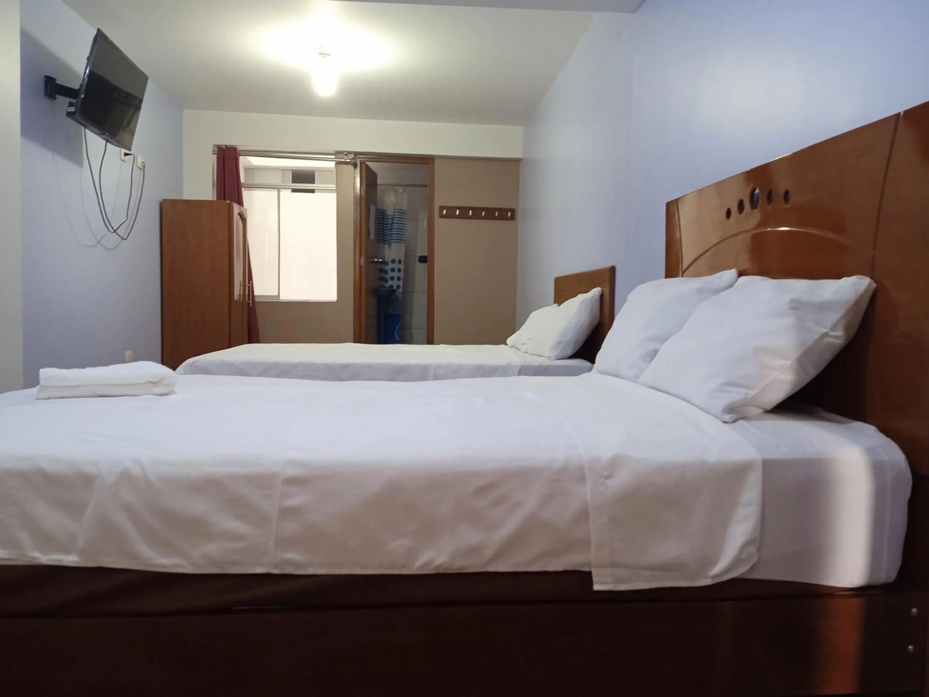 Bed in Hospedaje Feliz