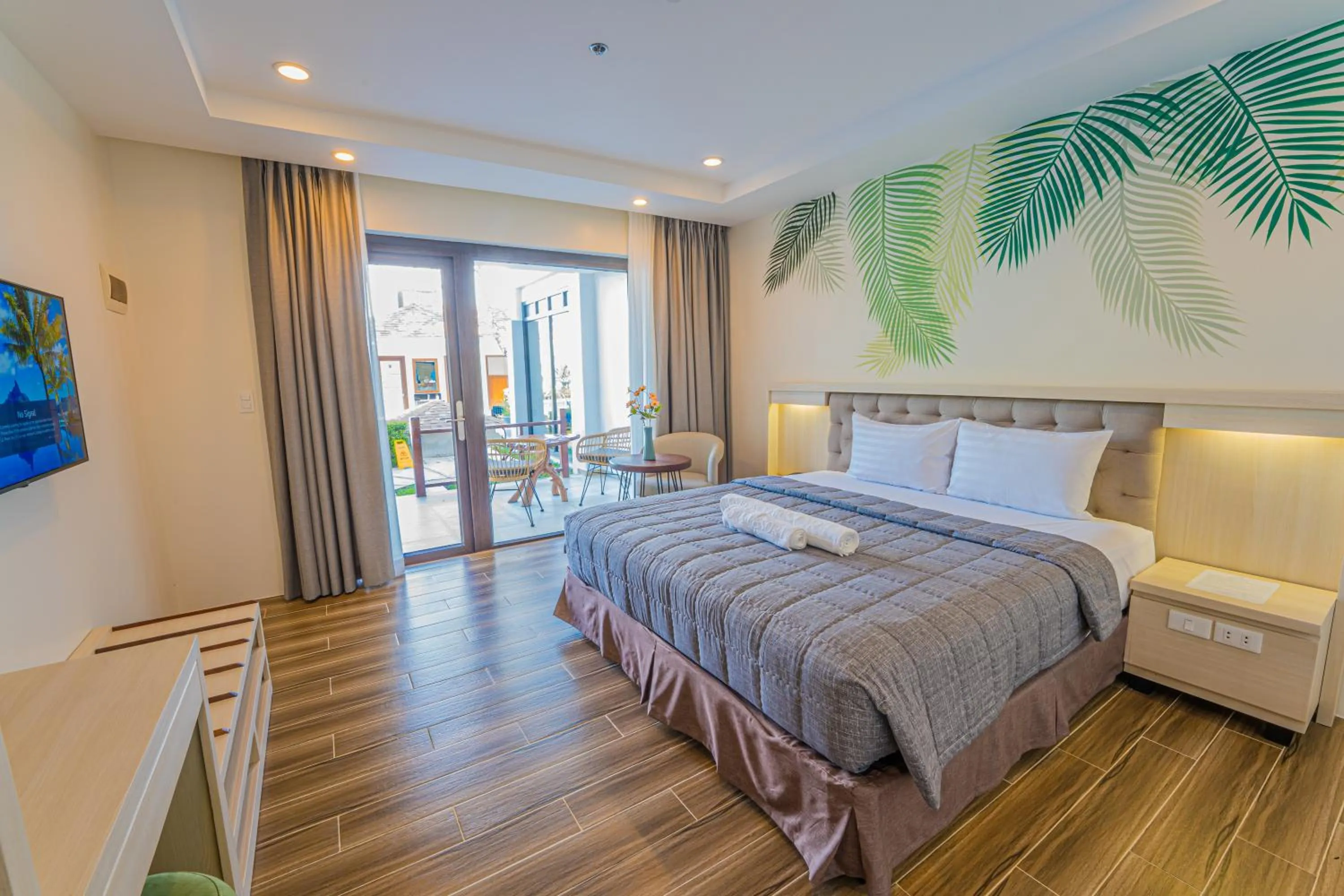 Seating area, Bed in Ora Beach Resort