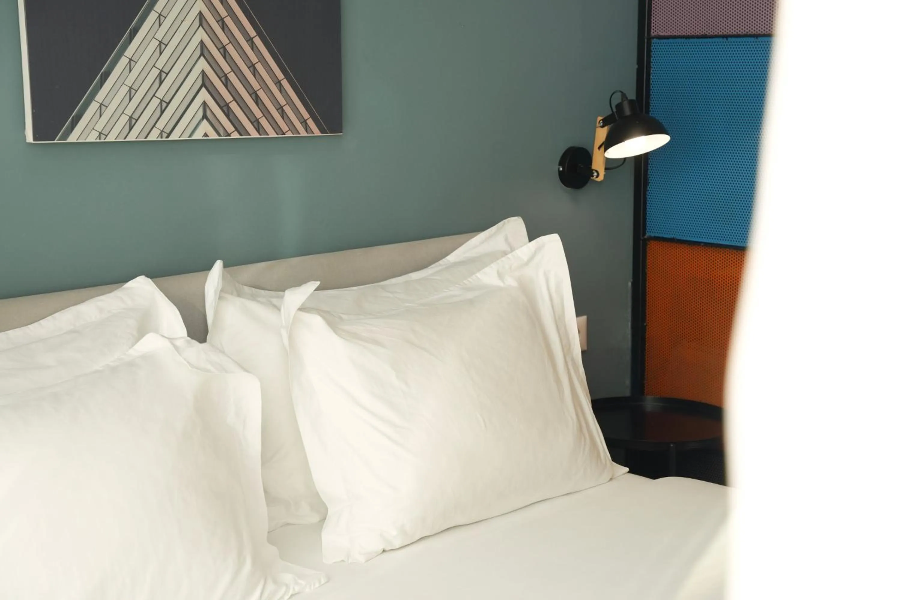 Bed in Ambassador Skyline Apartments