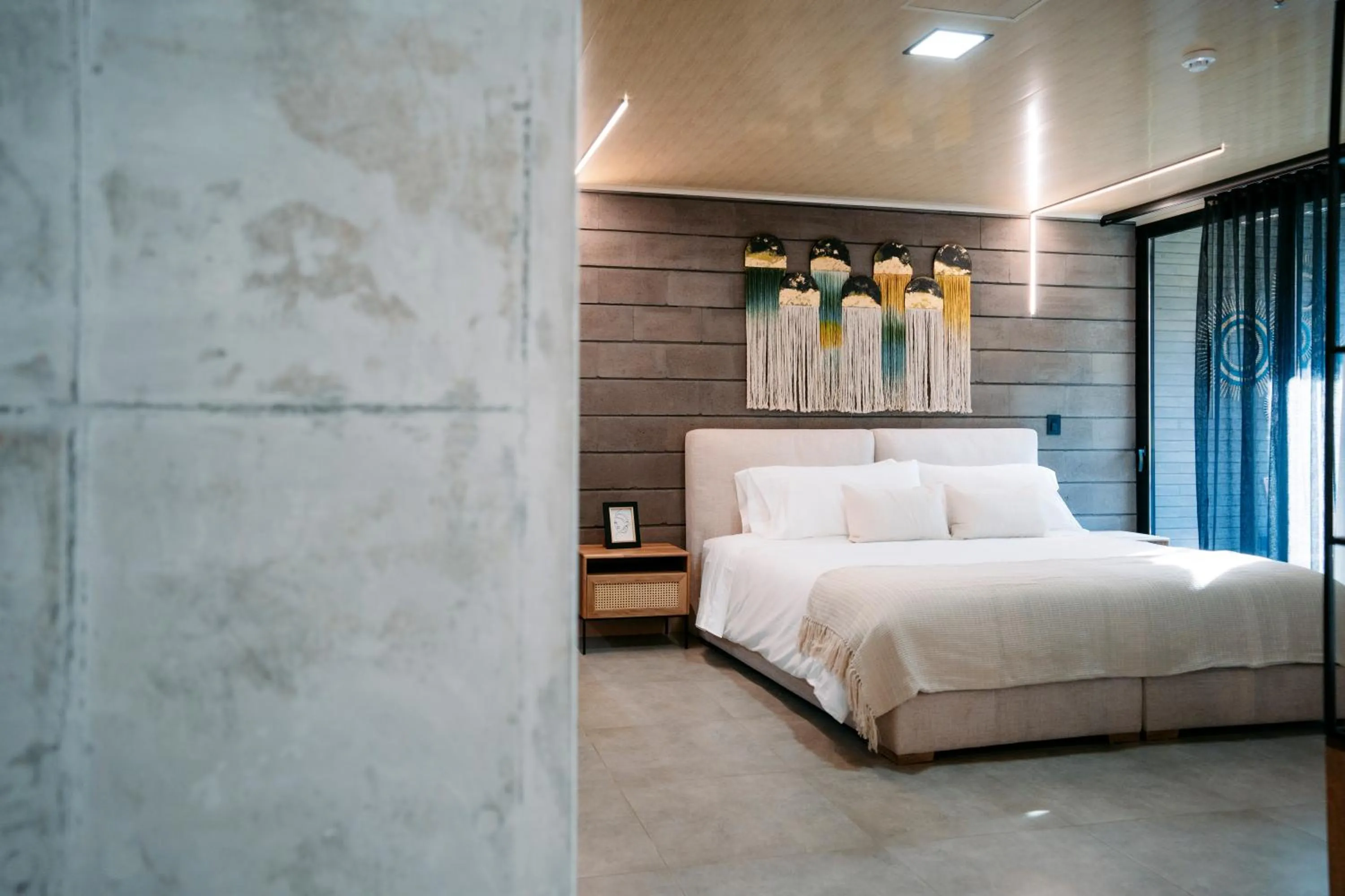 Bed in Hotel Living by Armoniko