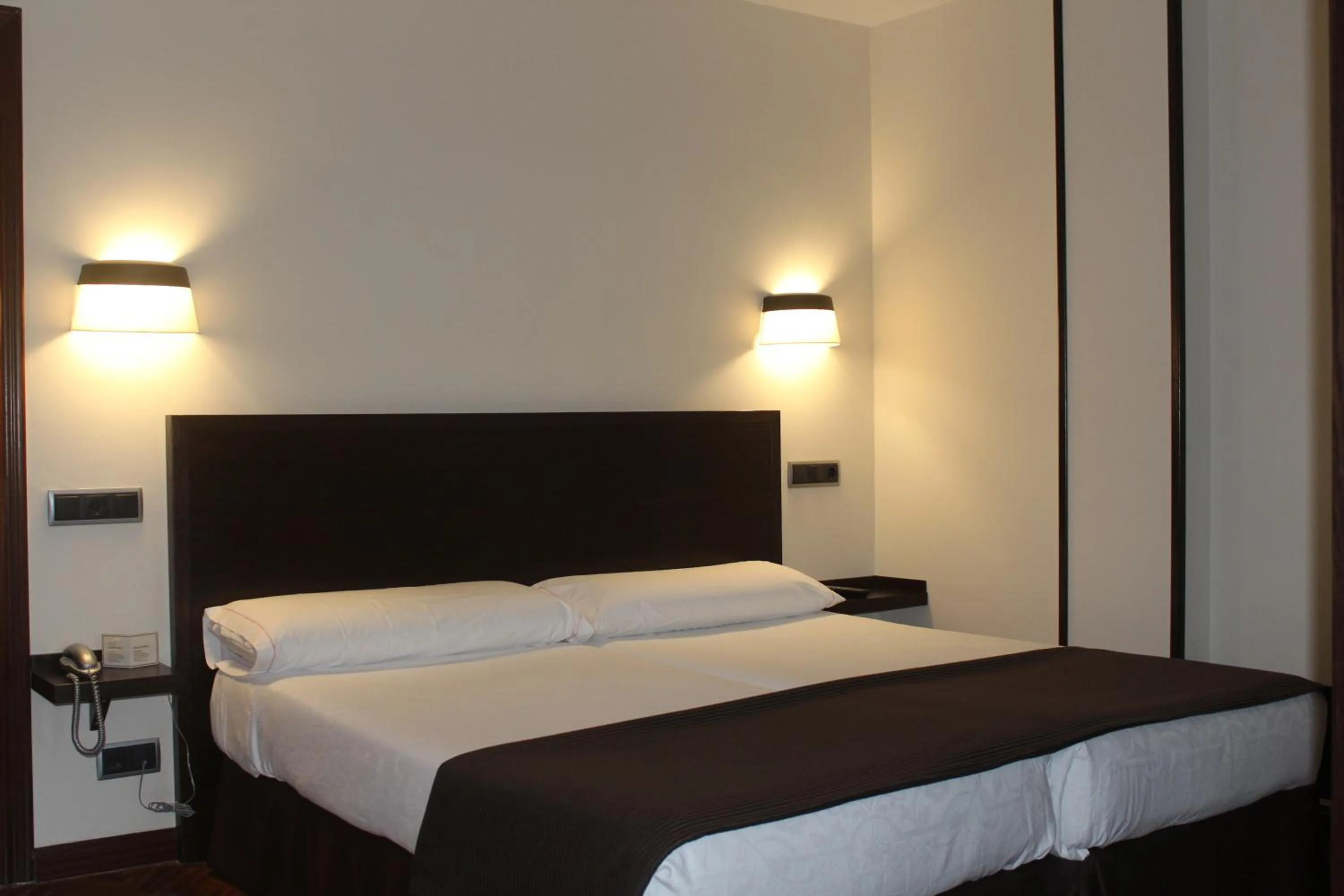 Bed in Hotel La Arquera