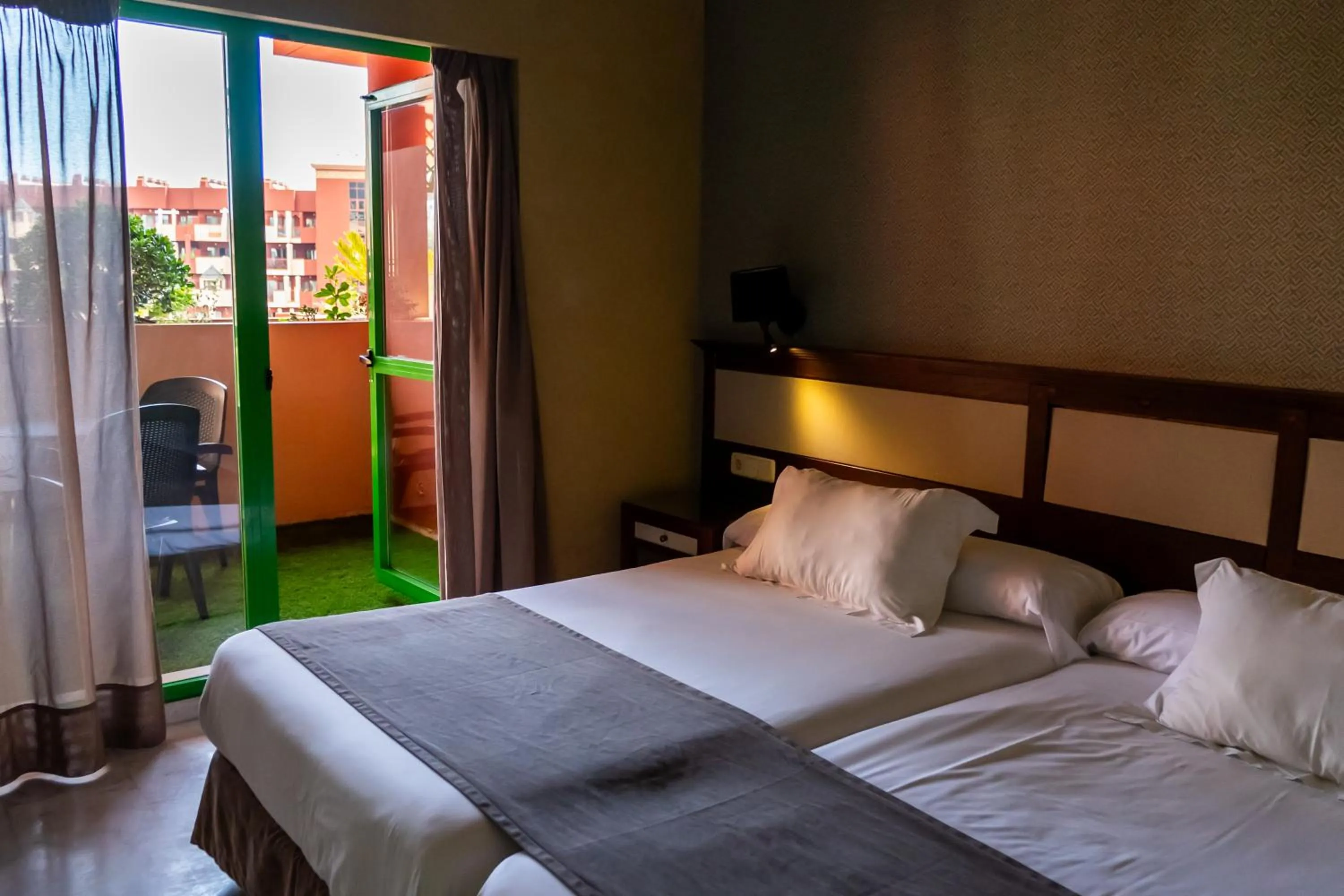 Bed in Holiday World RIWO Hotel.