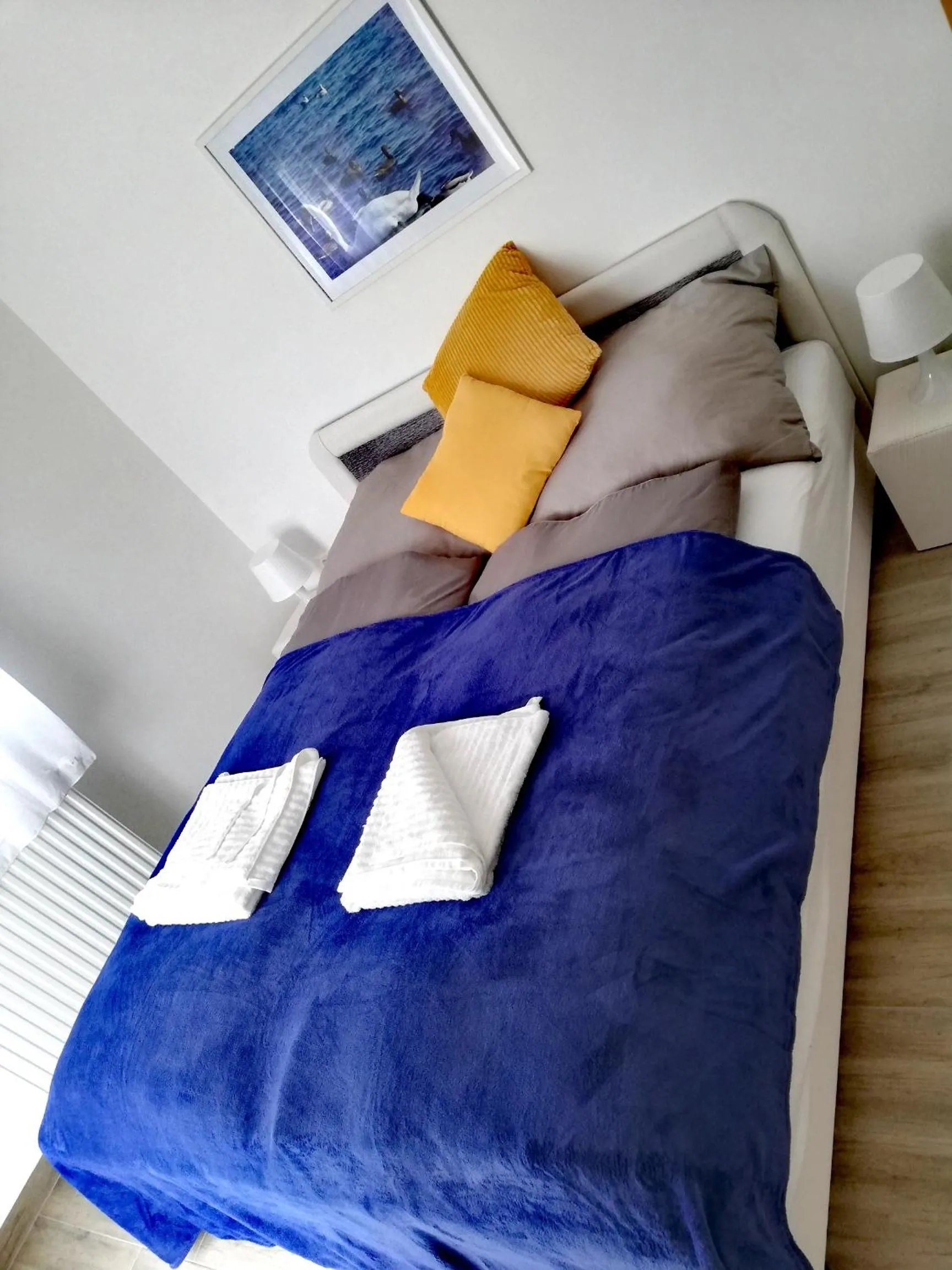Bed in Happy Apartments