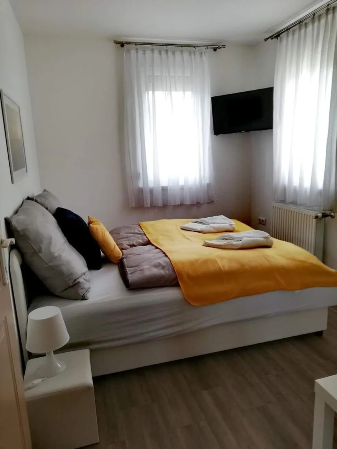 Bed in Happy Apartments