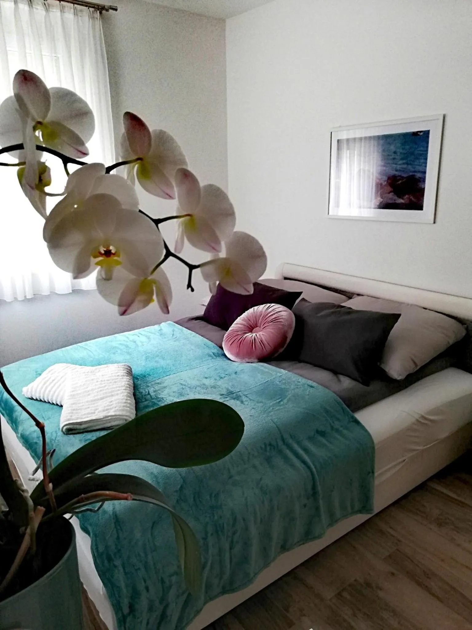 Bed in Happy Apartments