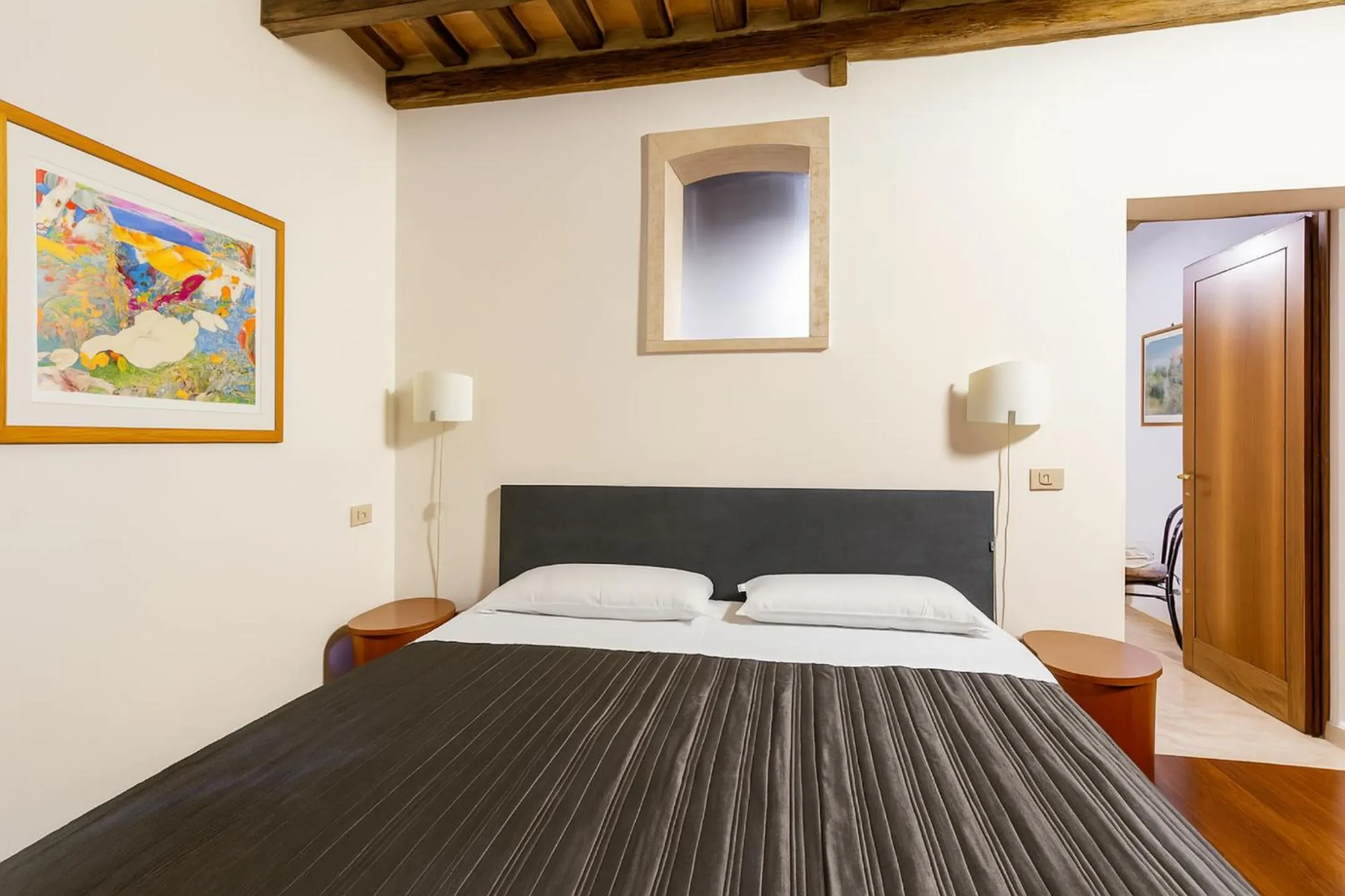 Bed in The Balcony Suite - Piazza del Campo