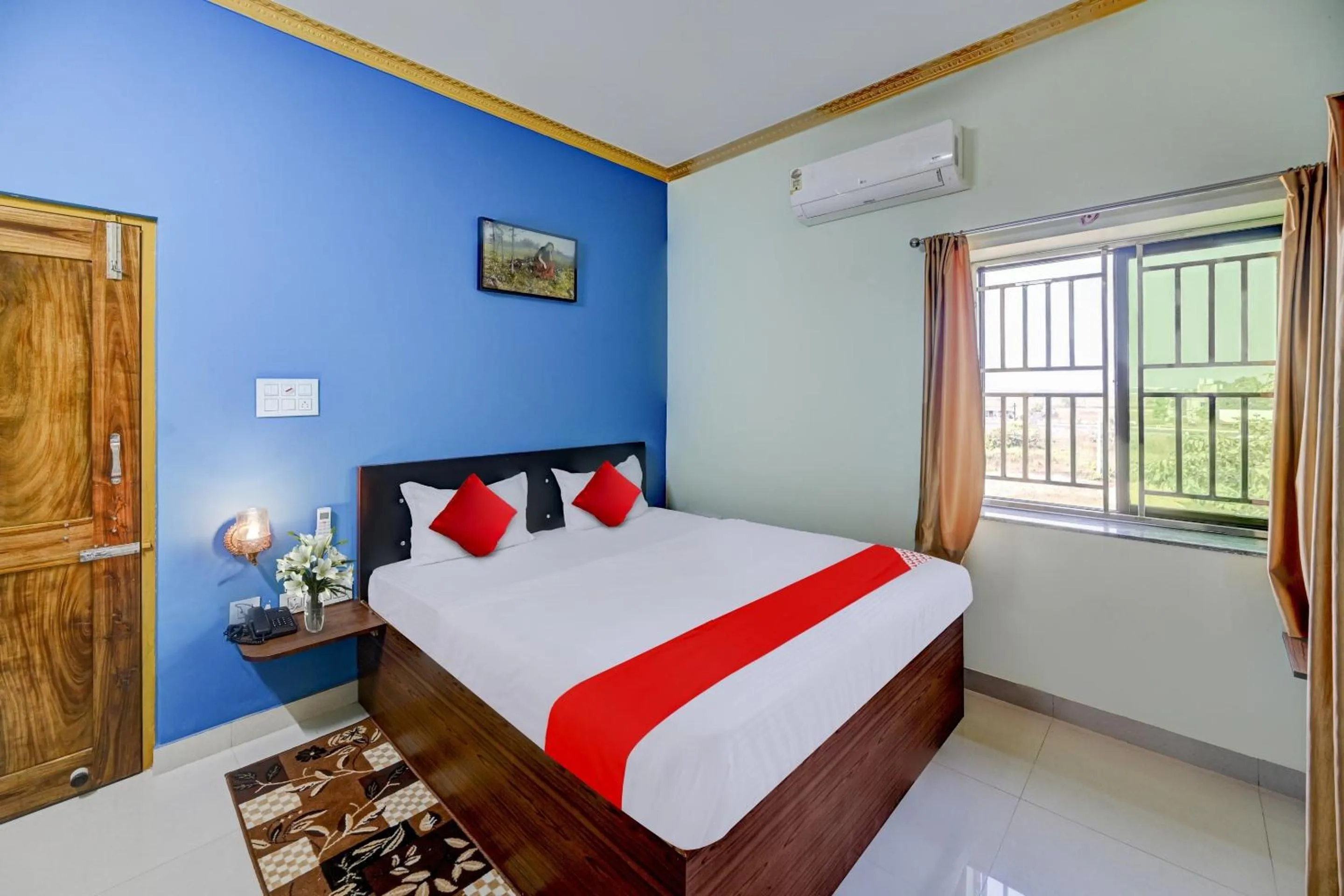 Bedroom in Hotel O GD STAY INN 1